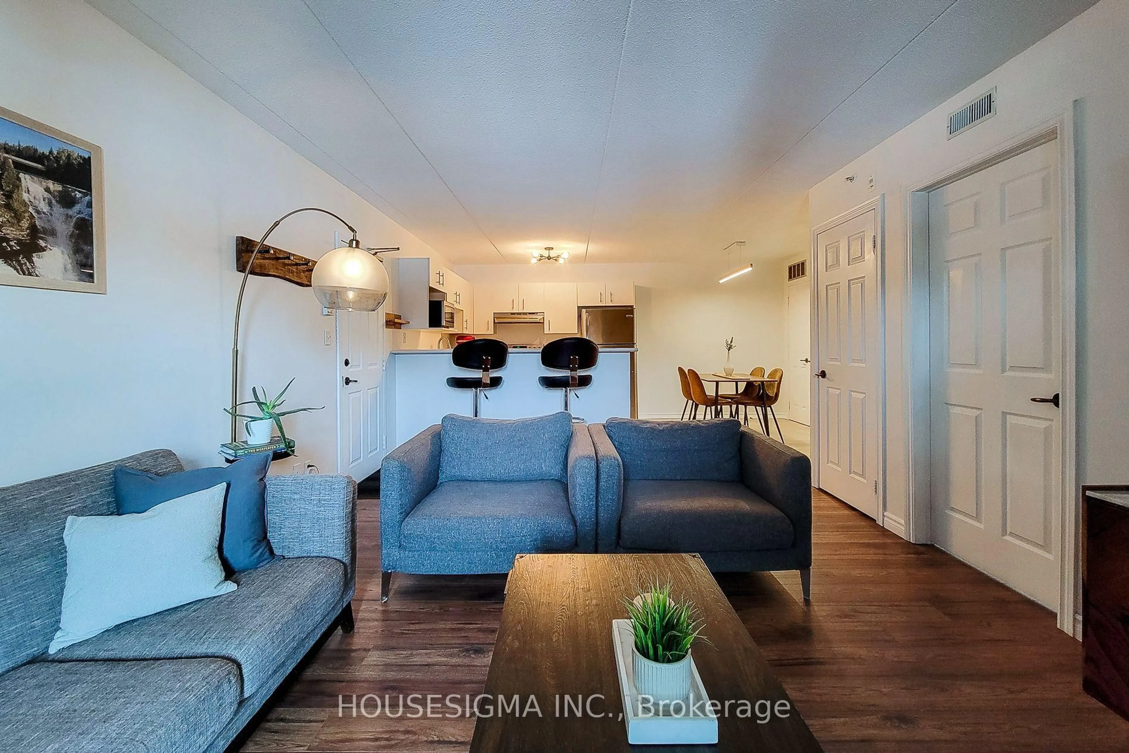 Living room with furniture, wood/laminate floor for 4003 Kilmer Dr #204, Burlington Ontario L7M 4M1