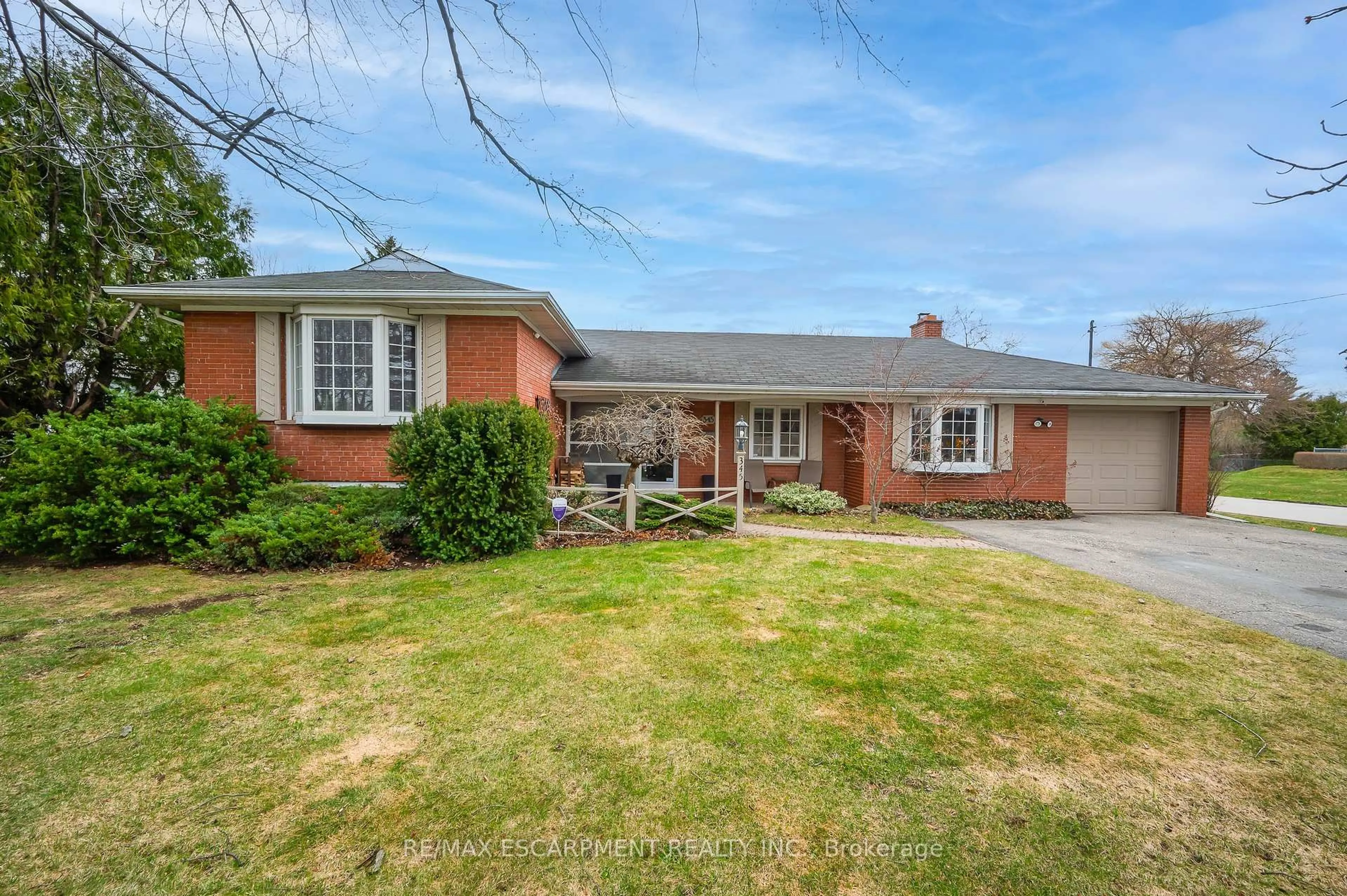 Home with brick exterior material, street for 345 Sandlewood Rd, Oakville Ontario L6L 3S1