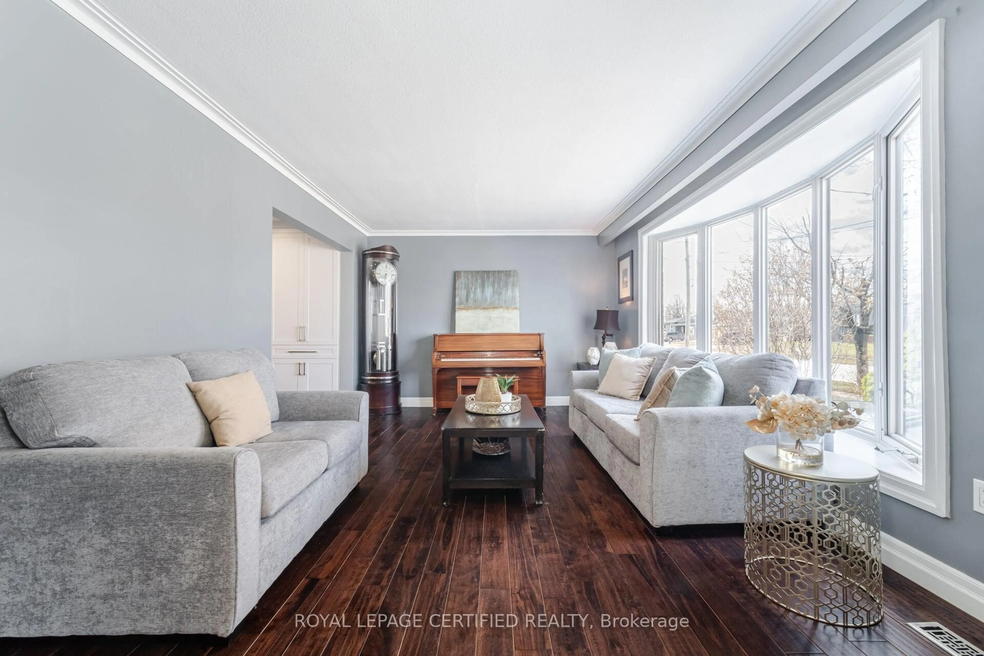 Living room with furniture, wood/laminate floor for 5 Stockman Cres, Halton Hills Ontario L7G 1J5