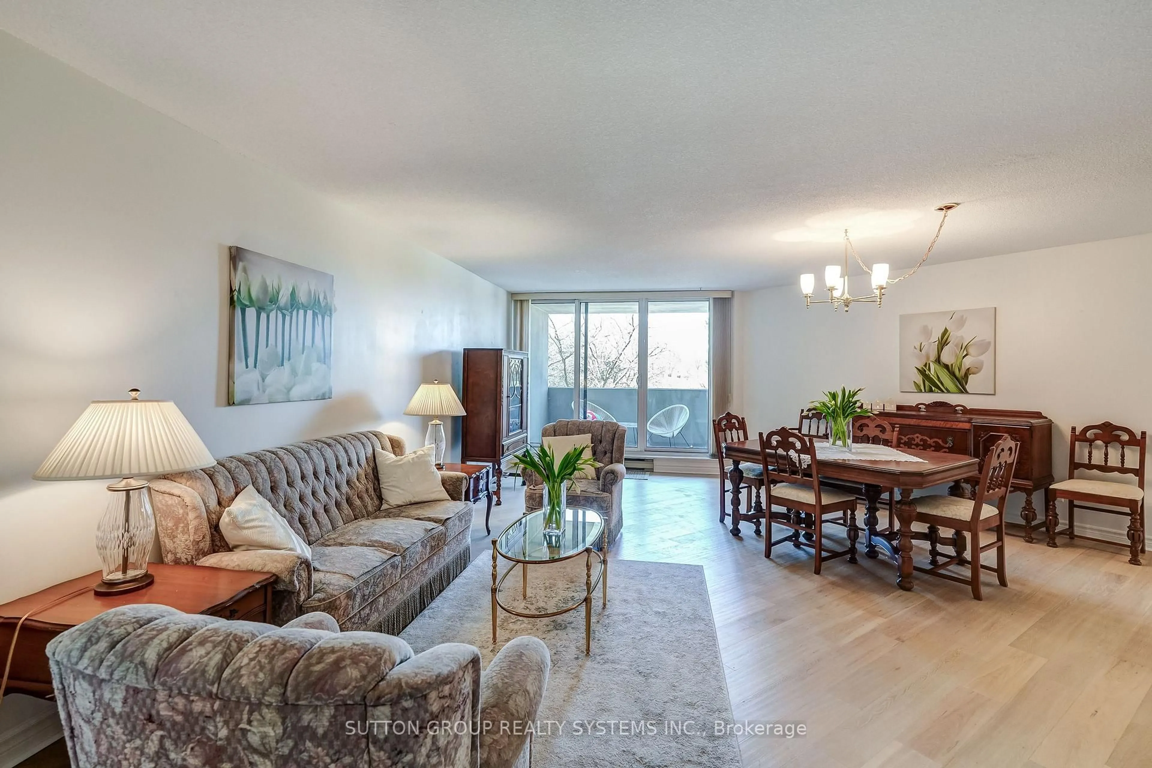 Living room with furniture, wood/laminate floor for 95 La Rose Ave #308, Toronto Ontario M9P 3T2