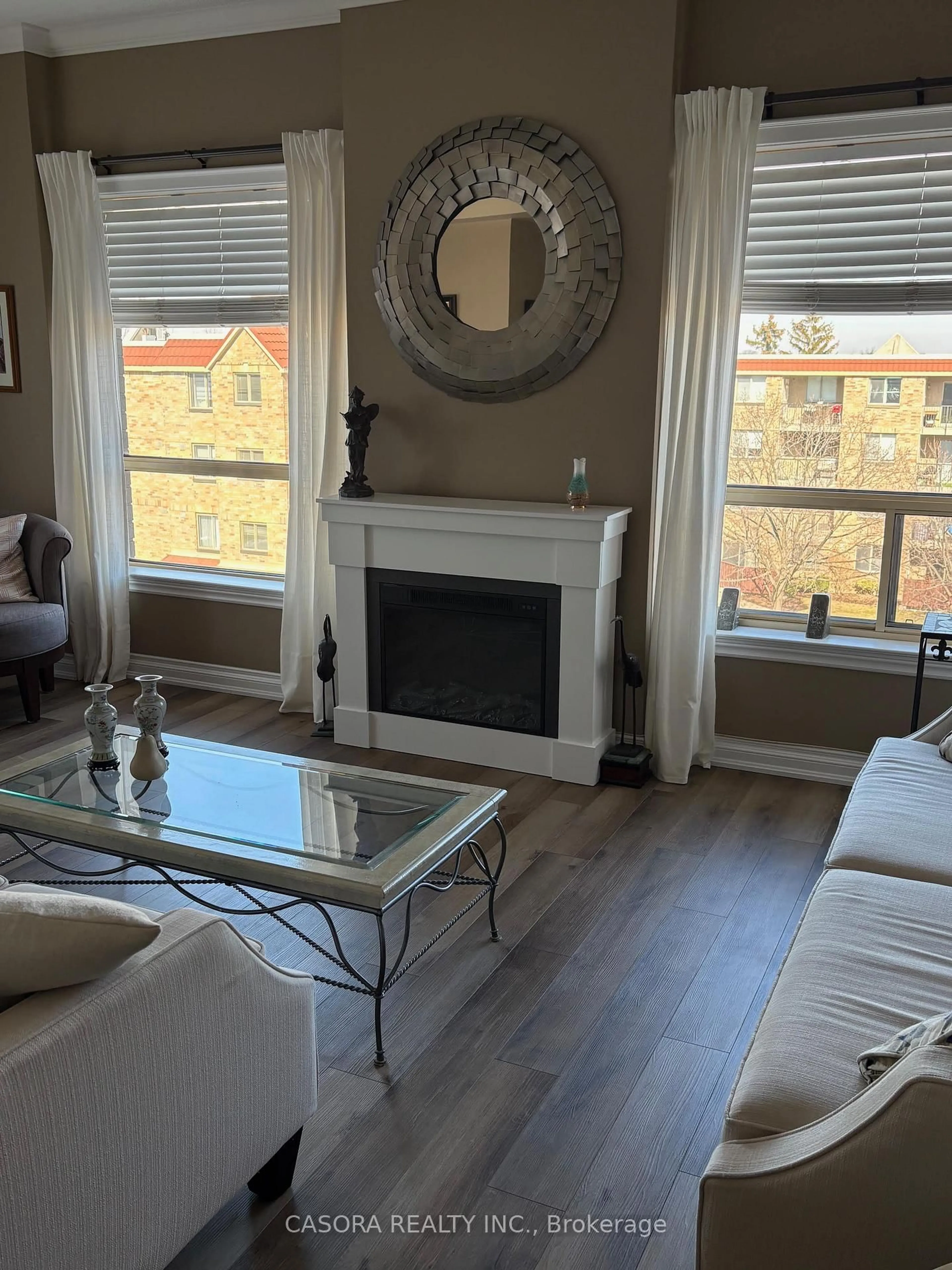 Living room with furniture, wood/laminate floor for 3497 Upper Middle Rd #402, Burlington Ontario L7M 4T6