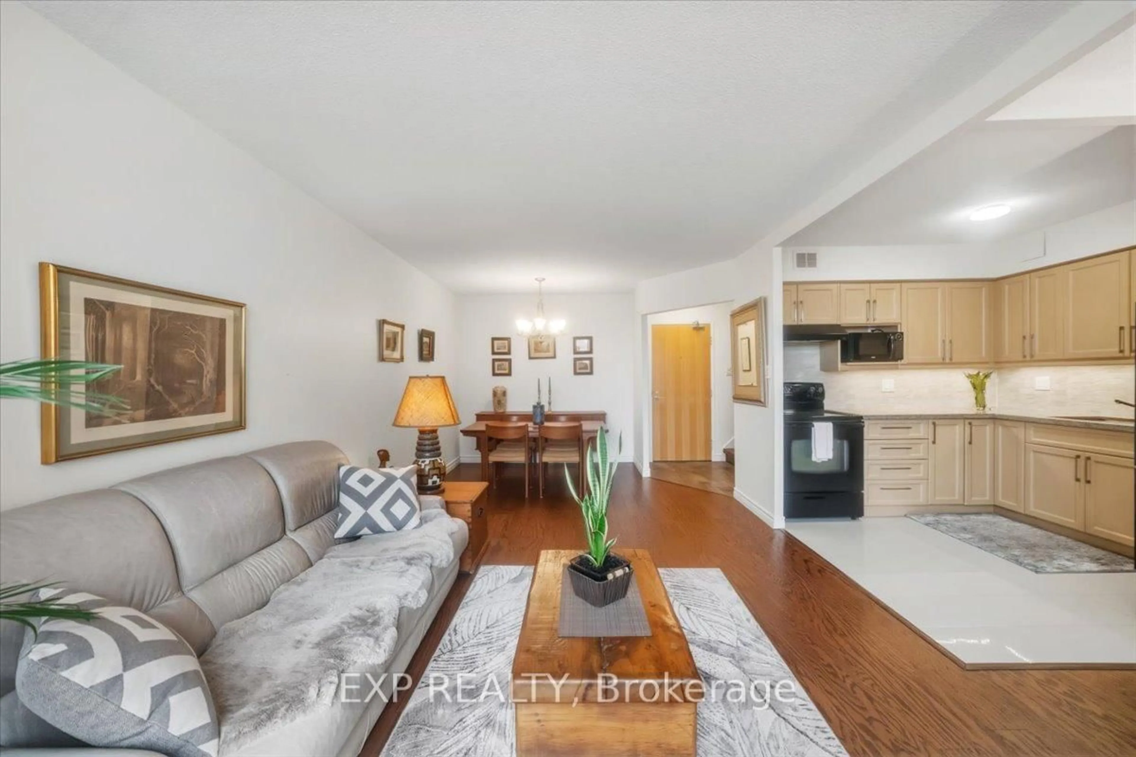 Living room with furniture, wood/laminate floor for 60 Southport St #617, Toronto Ontario M6S 3N4