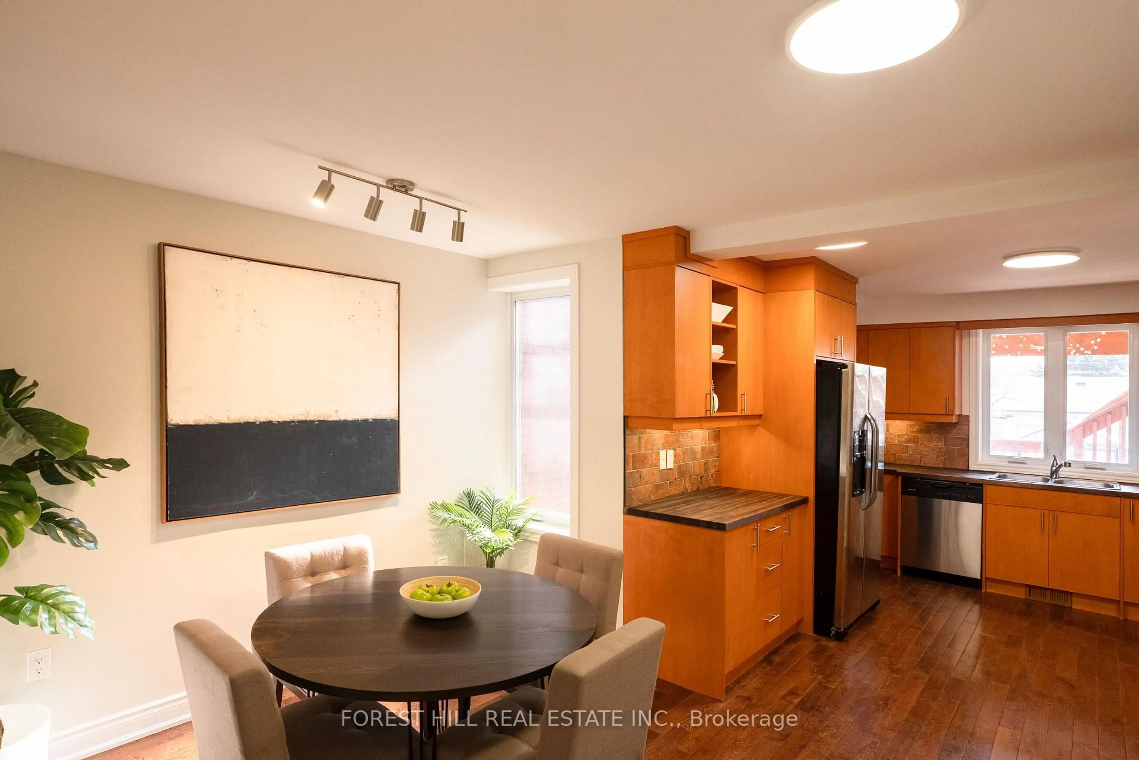 Open concept kitchen, wood/laminate floor for 32 Castleton Ave, Toronto Ontario M6N 3Z5