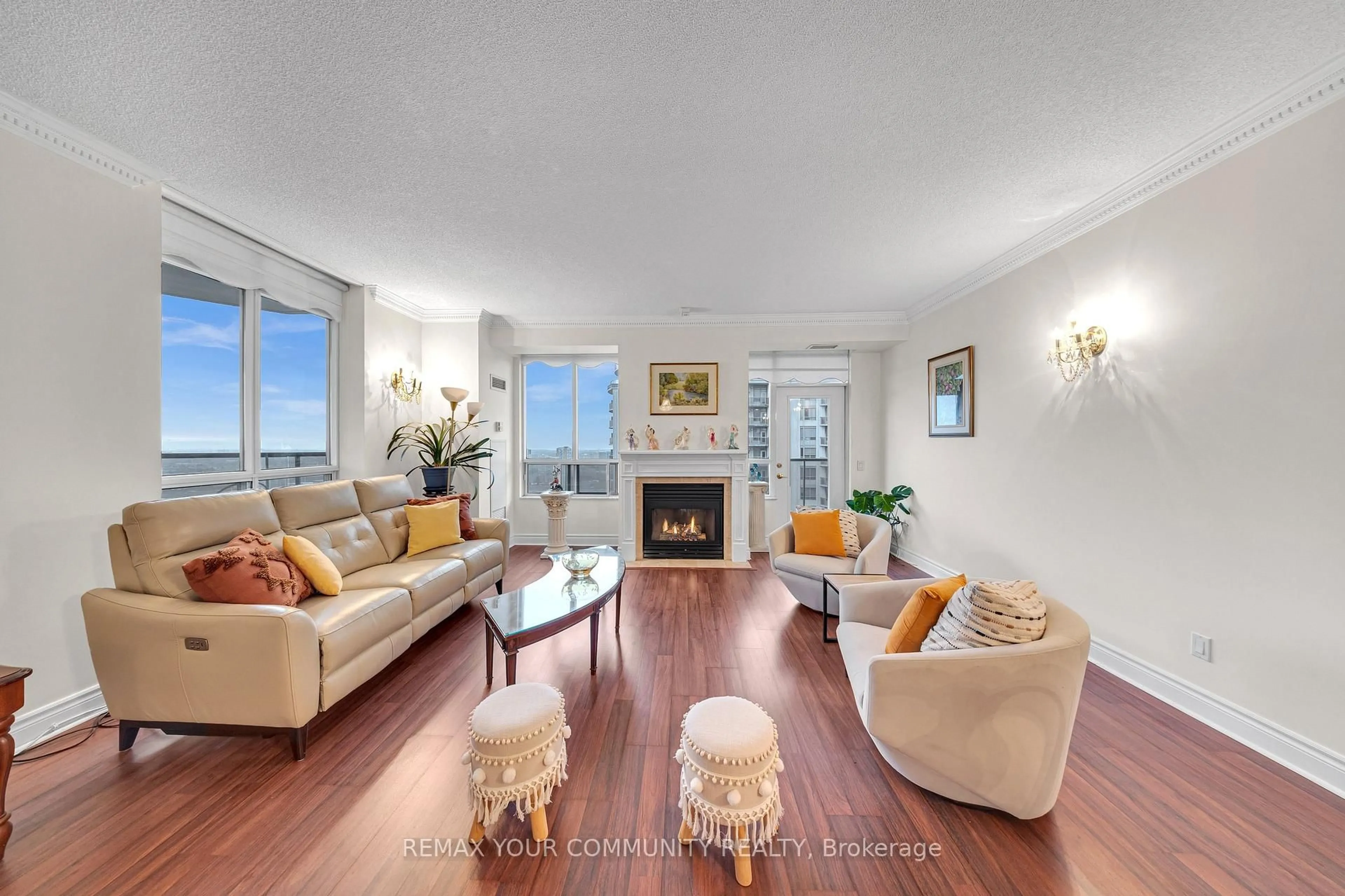 Living room with furniture, wood/laminate floor for 35 Kingsbridge Garden Circ #3005, Mississauga Ontario L5R 3Z5