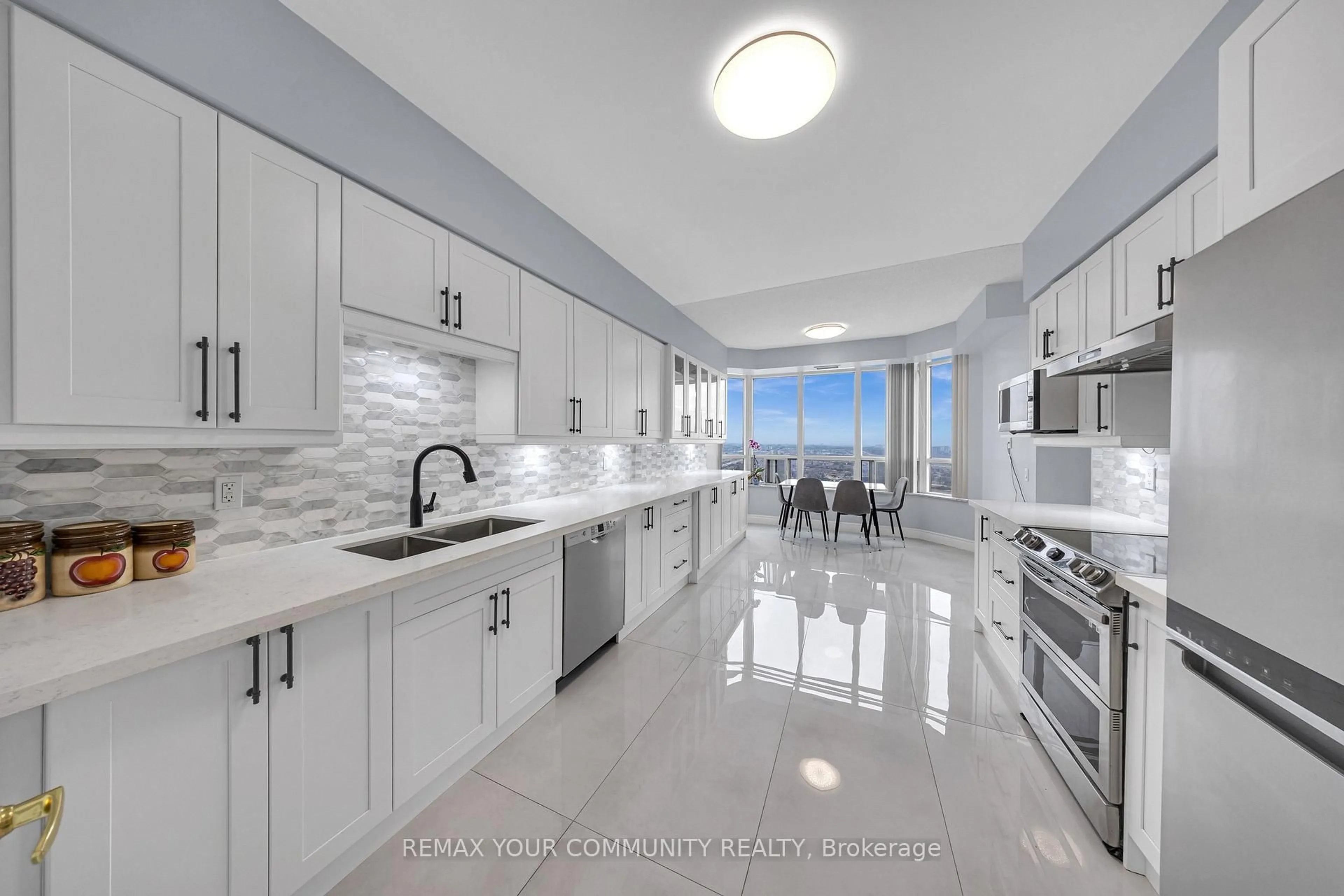 Open concept kitchen, ceramic/tile floor for 35 Kingsbridge Garden Circ #3005, Mississauga Ontario L5R 3Z5