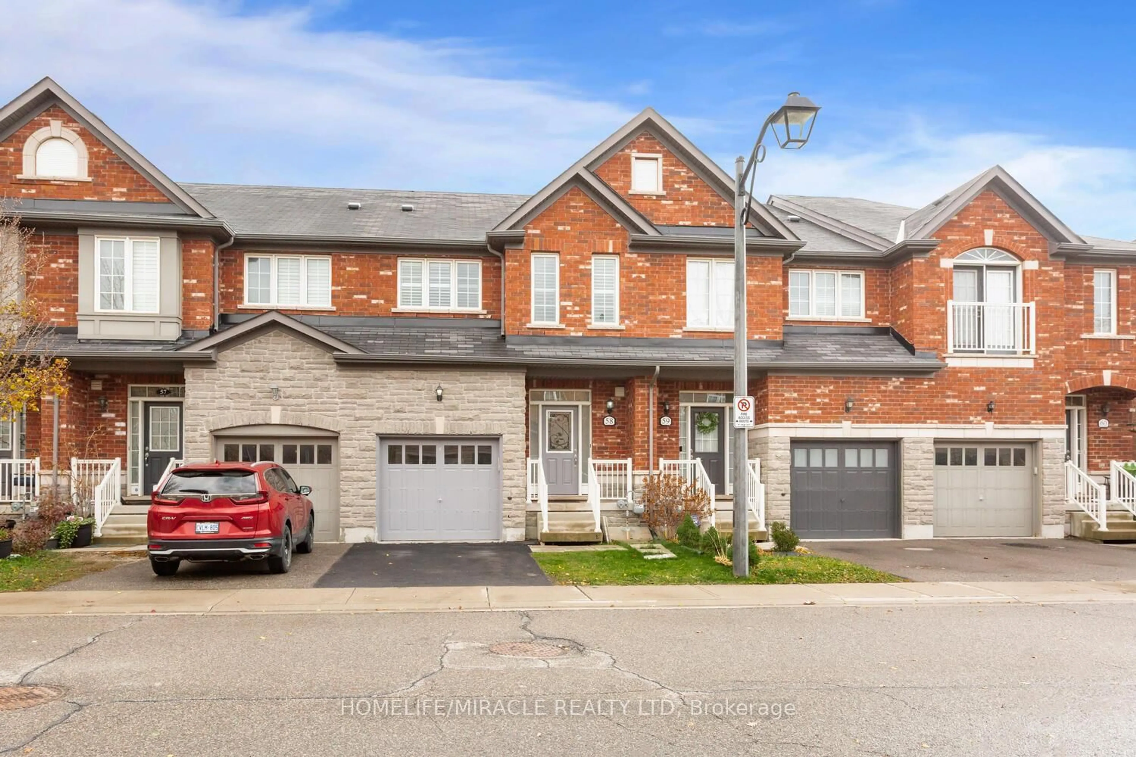 Home with brick exterior material, street for 745 Farmstead Dr #58, Milton Ontario L9T 8B2