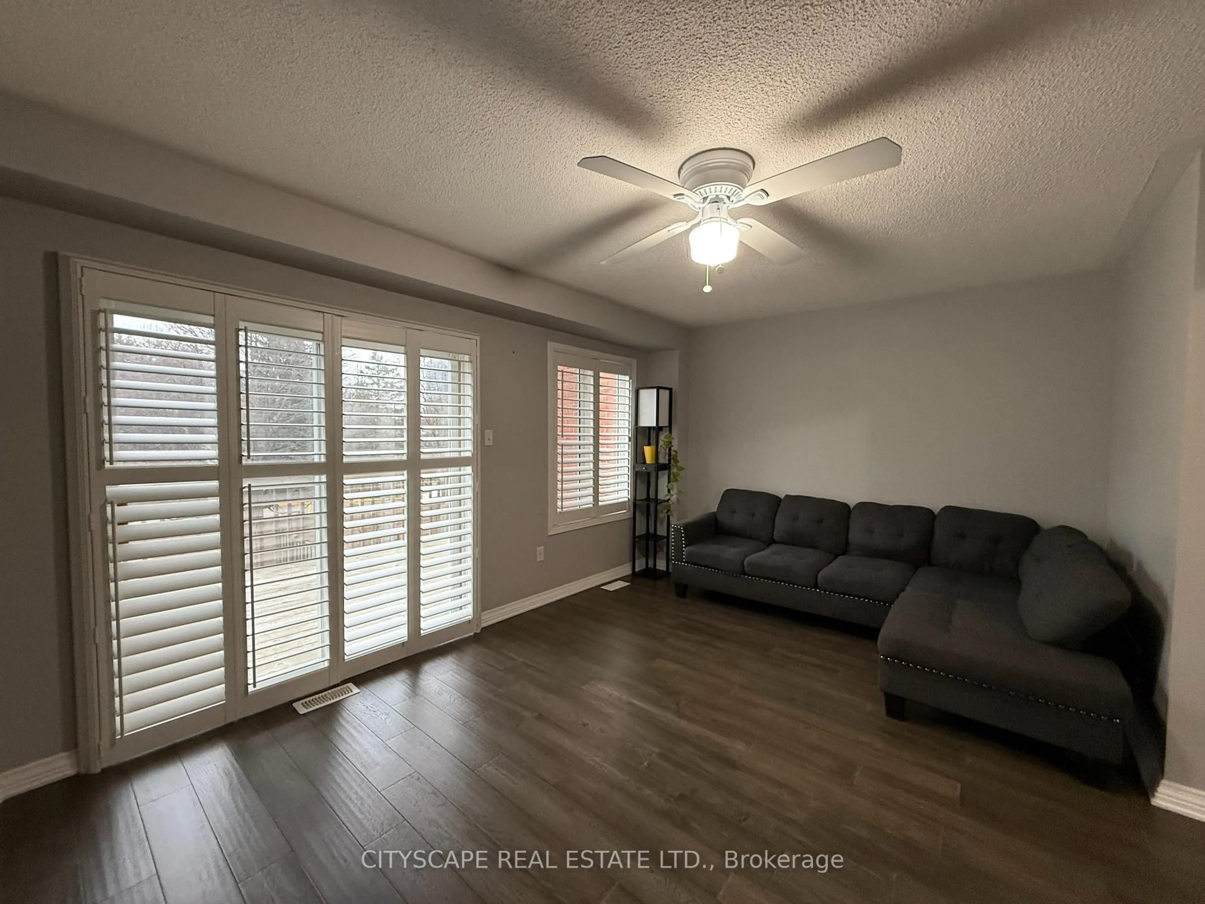 Living room with furniture, wood/laminate floor for 120 Railroad St #51, Brampton Ontario L6X 5A1
