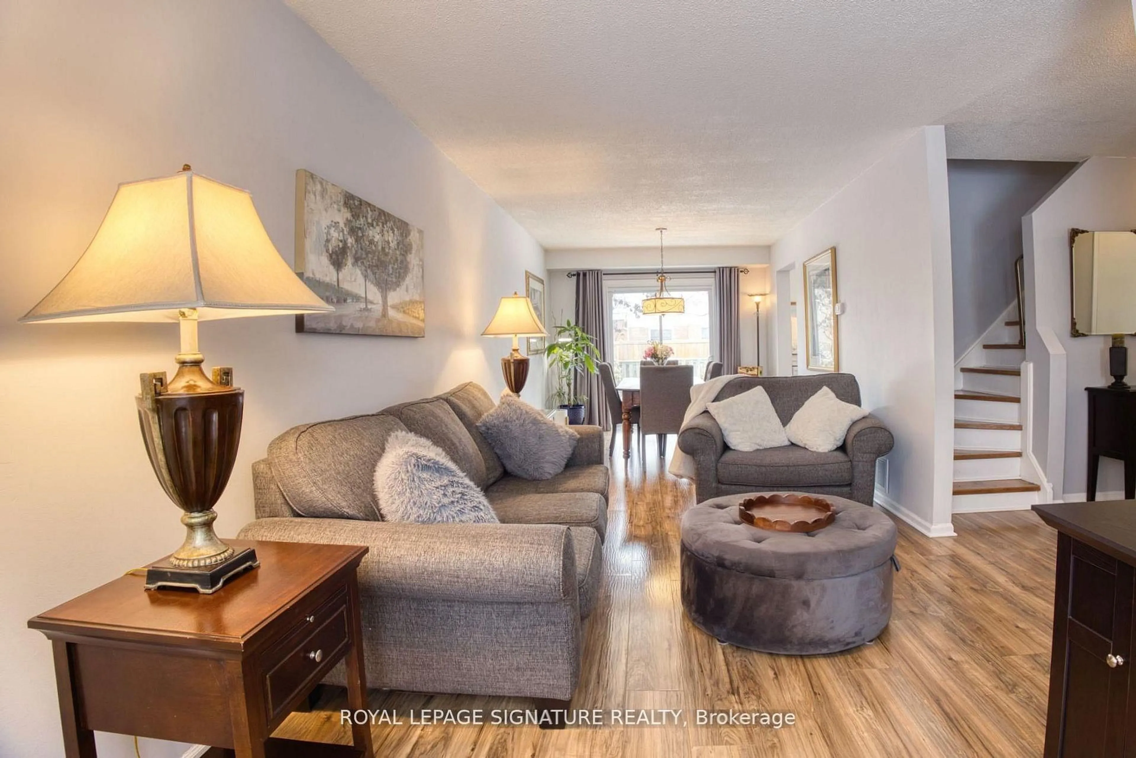 Living room with furniture, wood/laminate floor for 6448 Colebrook Cres, Mississauga Ontario L5N 3E4