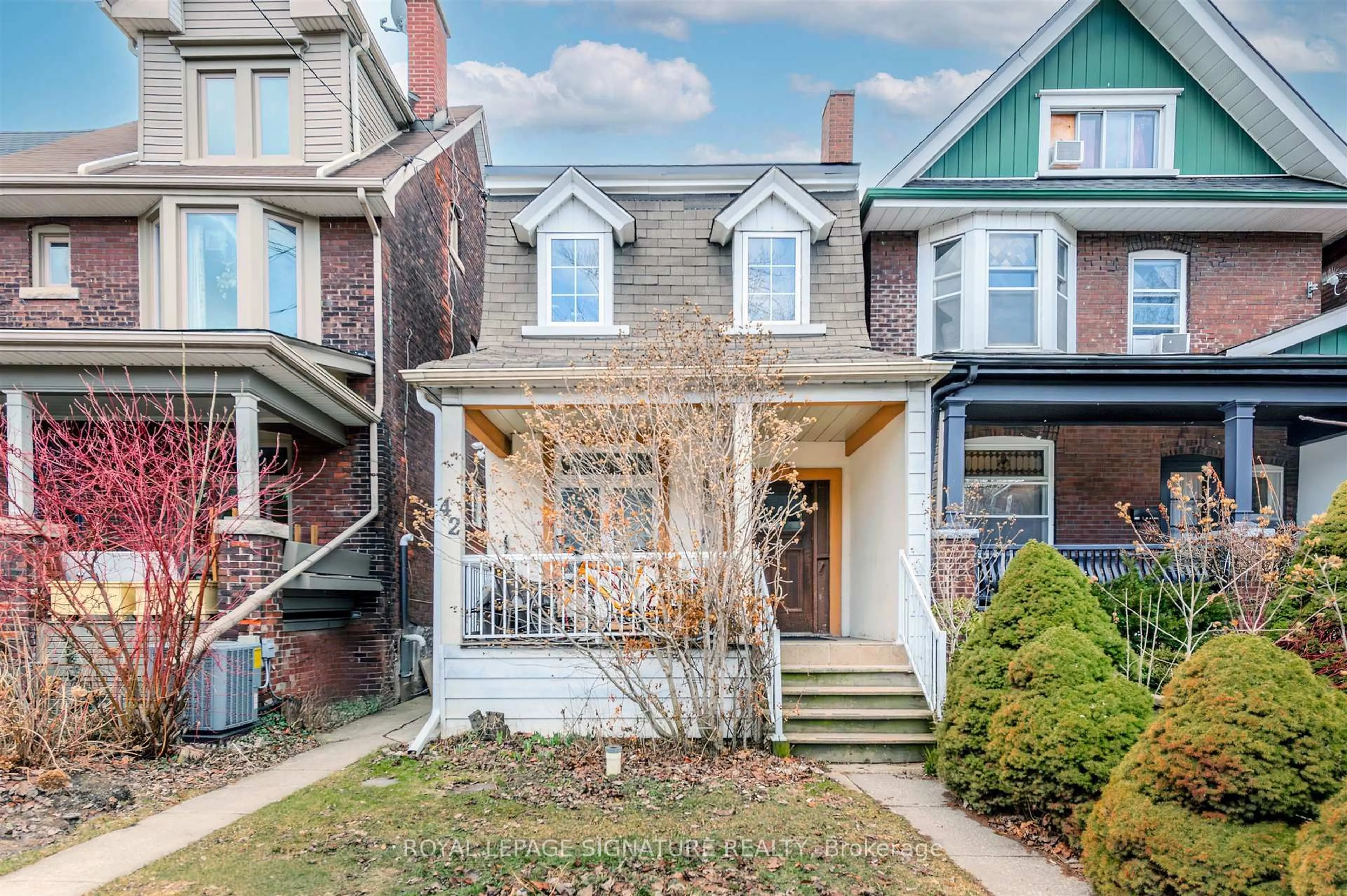 Home with brick exterior material, street for 42 Sorauren Ave, Toronto Ontario M6R 2C7