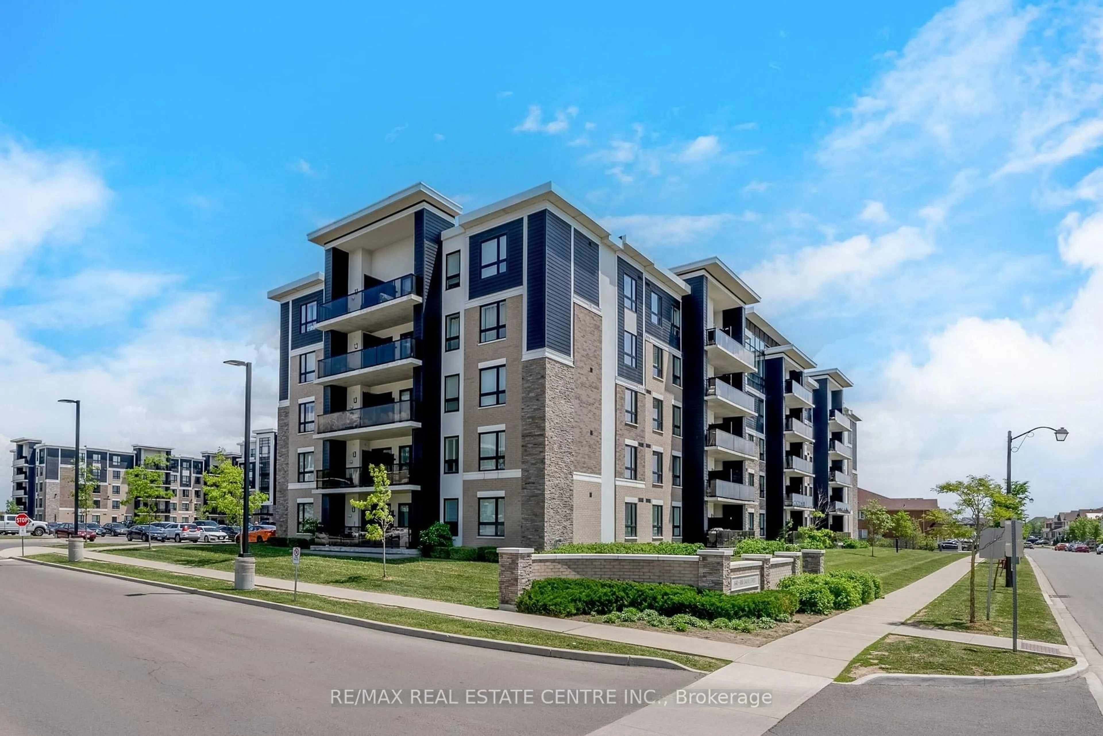 A pic from outside/outdoor area/front of a property/back of a property/a pic from drone, unknown for 650 Sauve St #408, Milton Ontario L9T 9A8