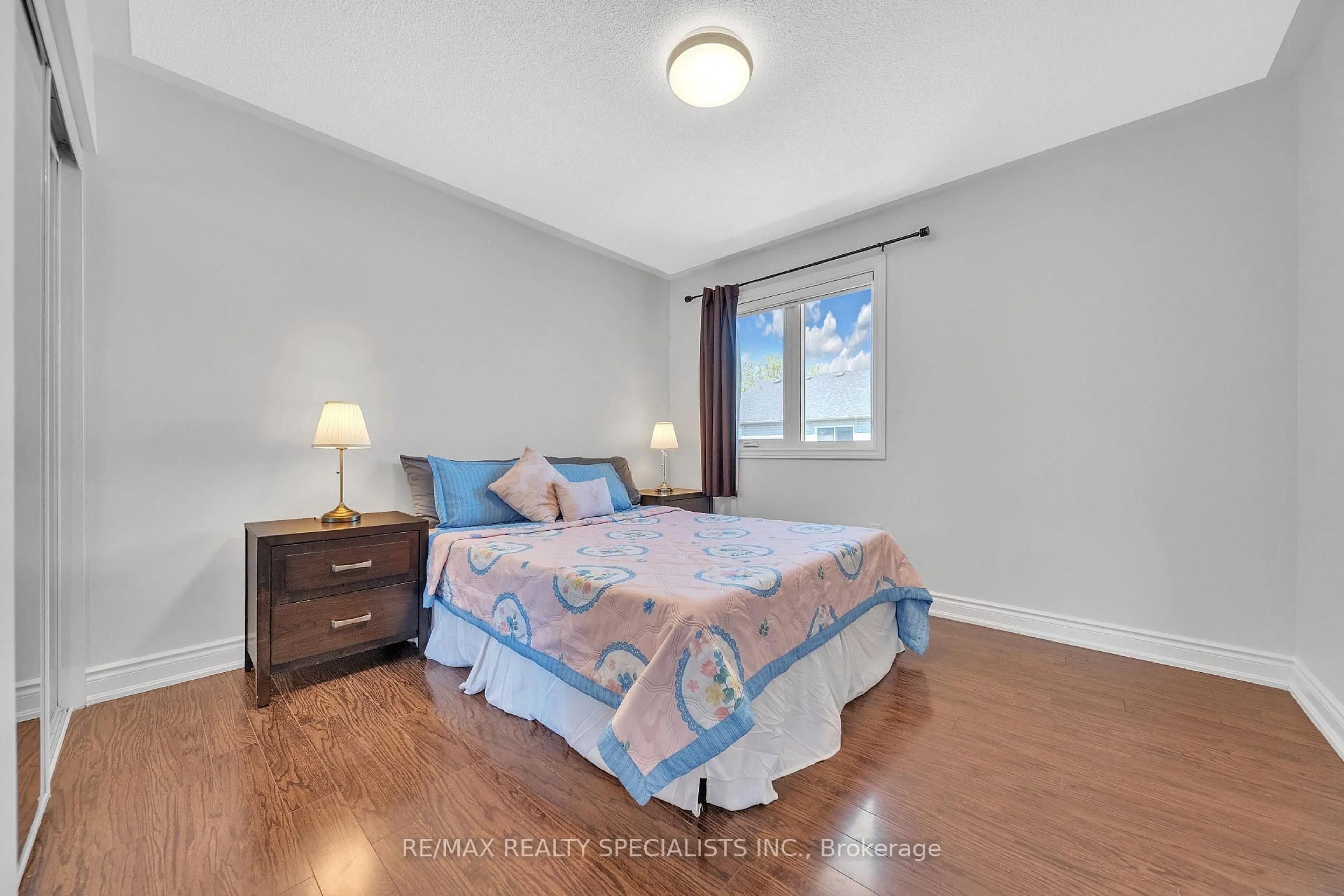 Bedroom with bed, wood/laminate floor for 22 Clayborne Ave, Brampton Ontario L7A 1N8