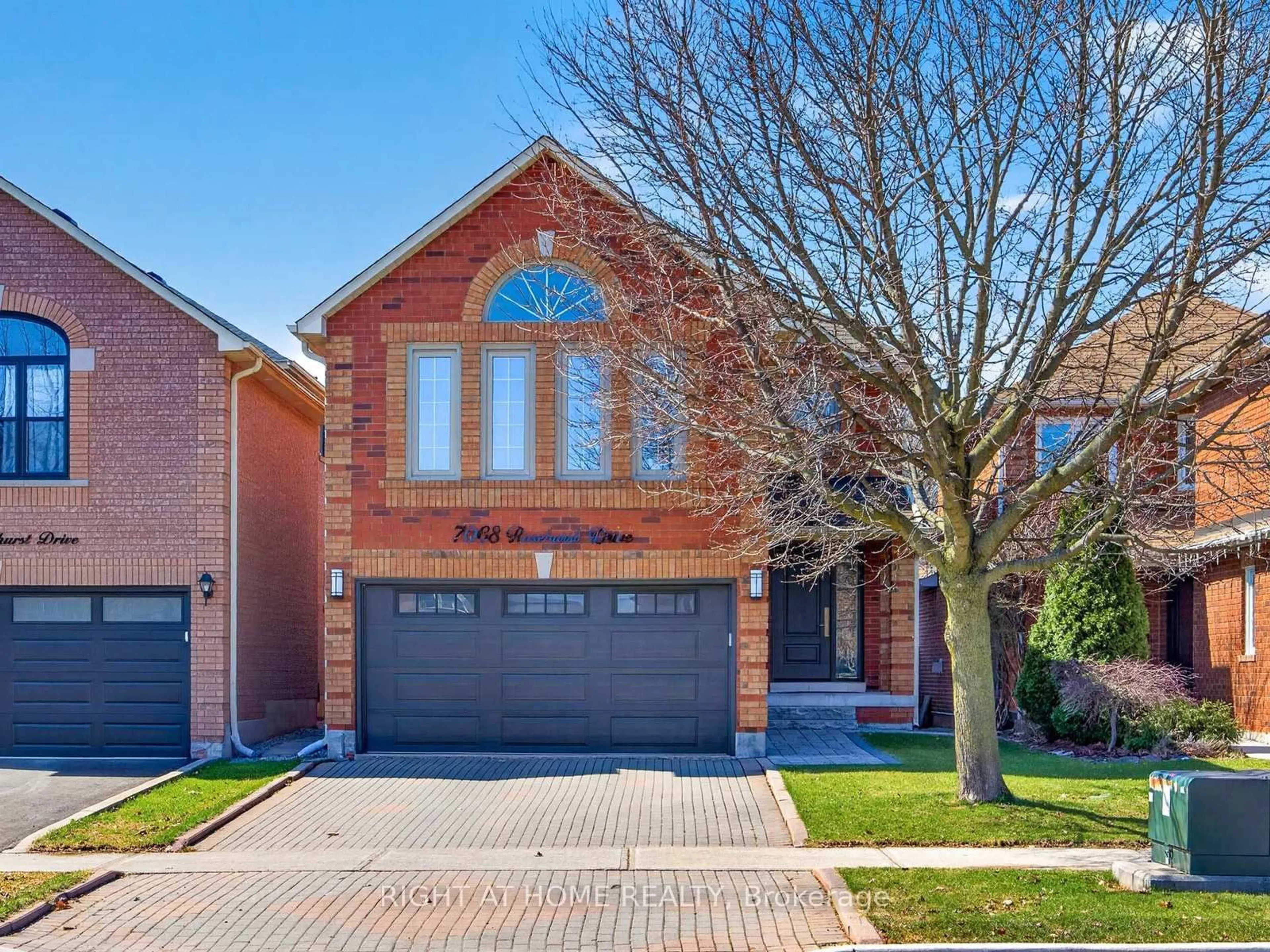 Home with brick exterior material, street for 7068 Rosehurst Dr, Mississauga Ontario L5N 6Y8