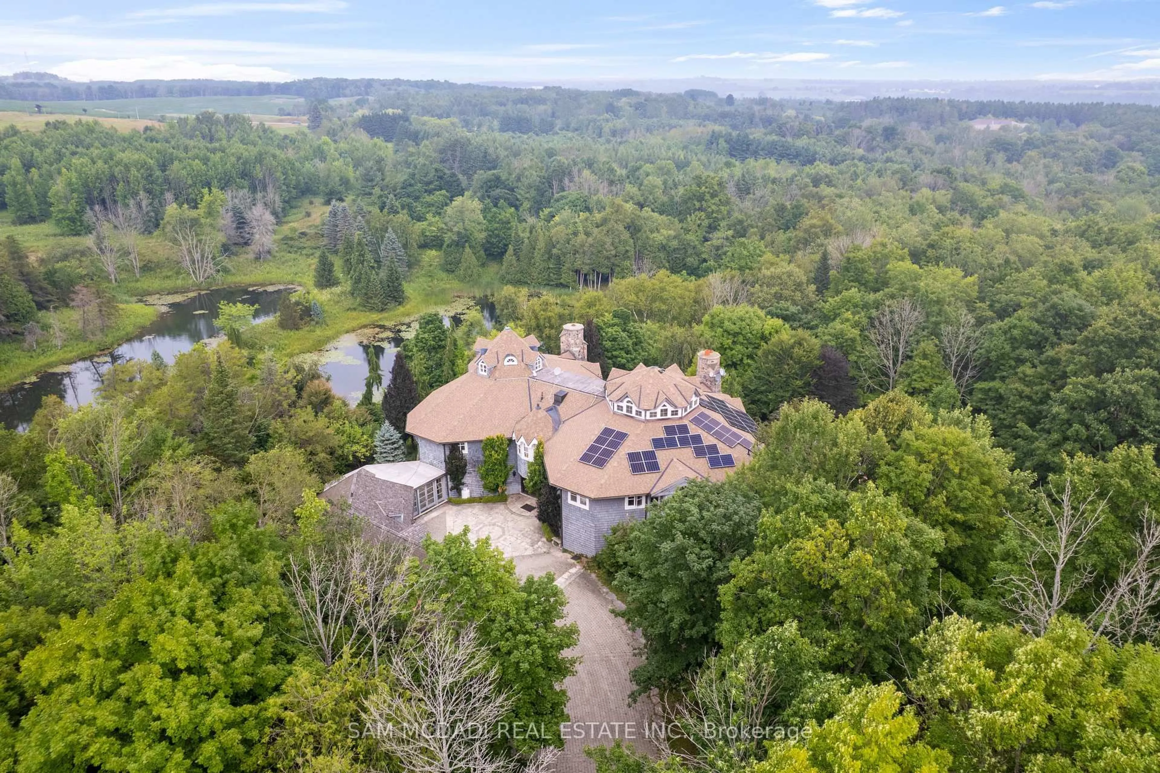 A pic from outside/outdoor area/front of a property/back of a property/a pic from drone, forest/trees view for 9 Flaherty Lane, Caledon Ontario L7K 2P2