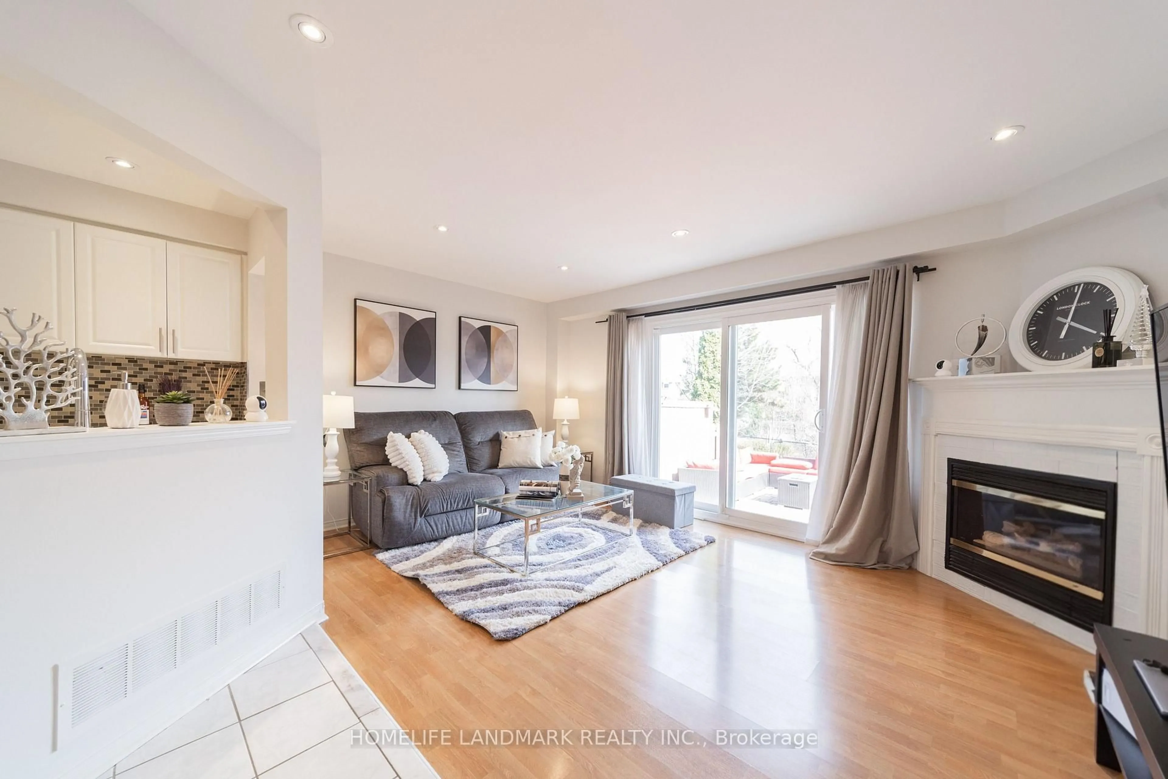 Living room with furniture, wood/laminate floor for 5420 Fallingbrook Dr #56, Mississauga Ontario L5V 2H6