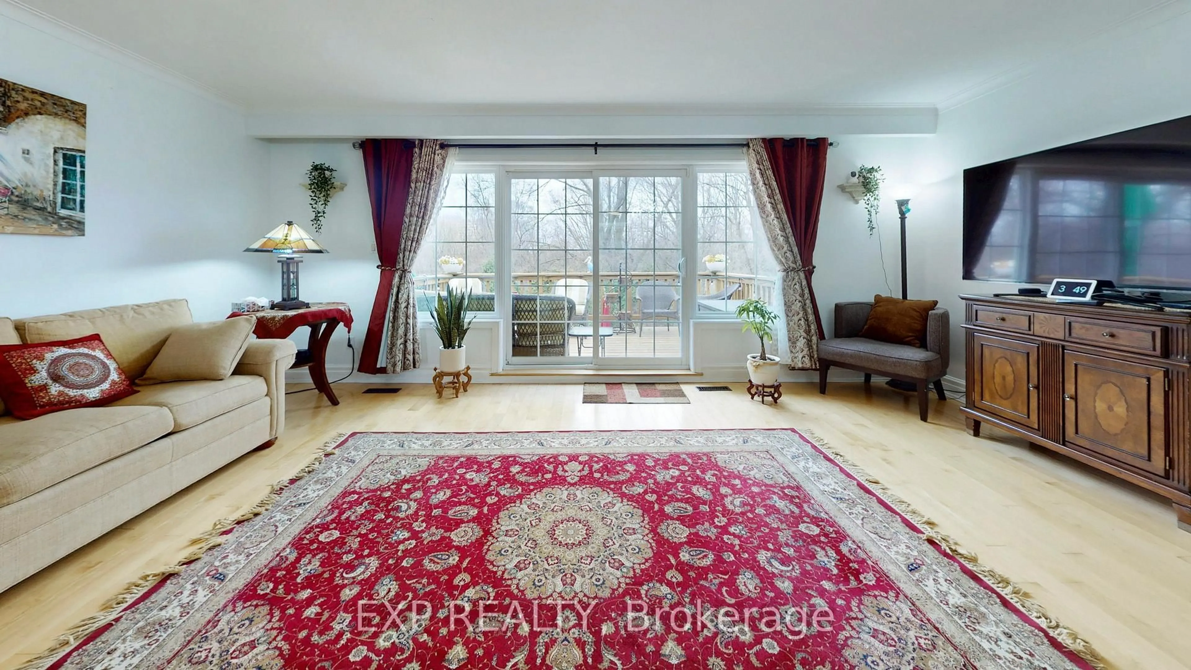 Living room with furniture, carpet floor for 77 Letchworth Cres, Toronto Ontario M3M 1Z1