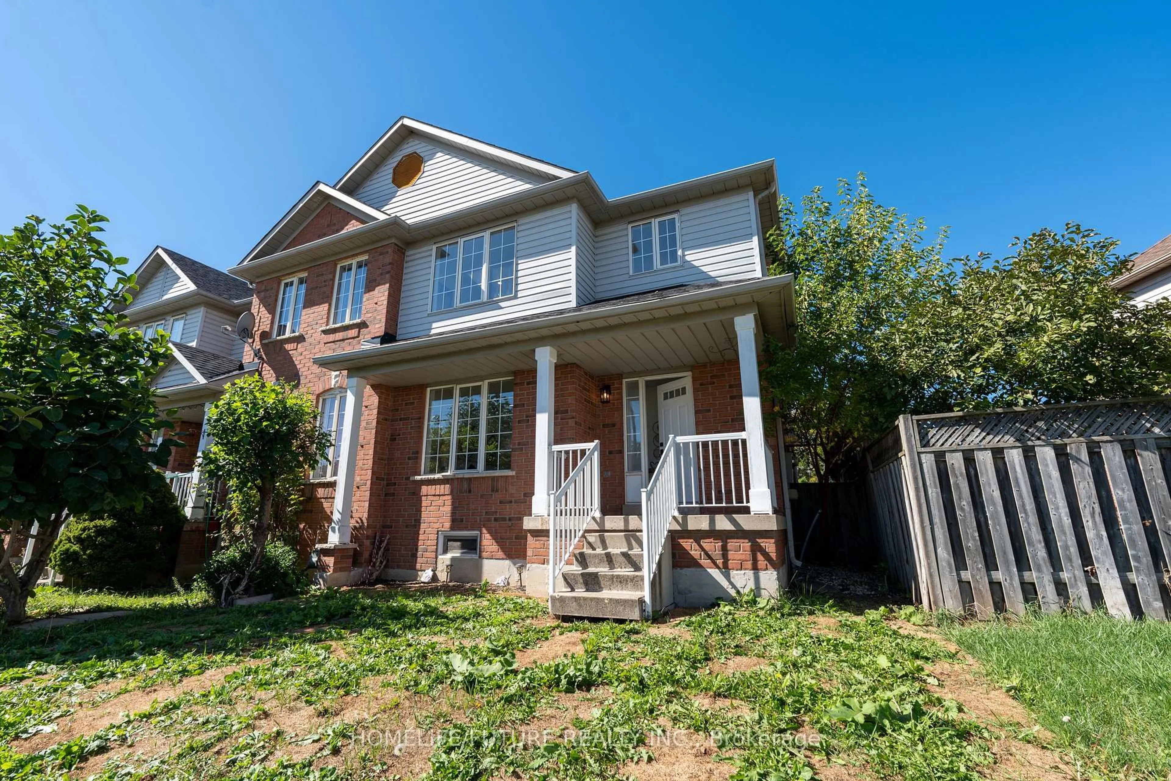 Home with brick exterior material, street for 136 Manley Lane, Milton Ontario L9T 5N9
