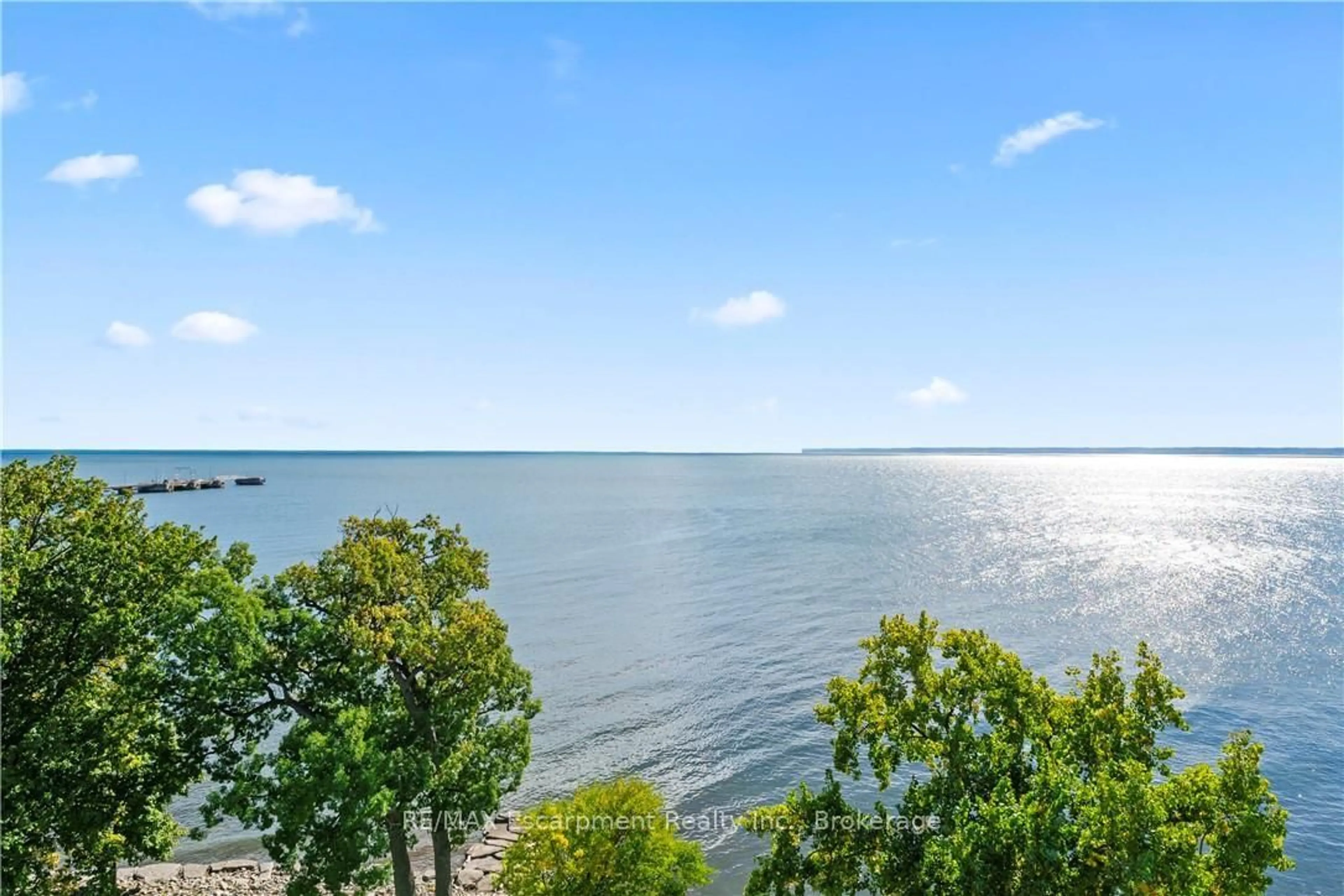 A pic from outside/outdoor area/front of a property/back of a property/a pic from drone, water/lake/river/ocean view for 3500 Lakeshore Rd #827, Oakville Ontario L6L 0B4