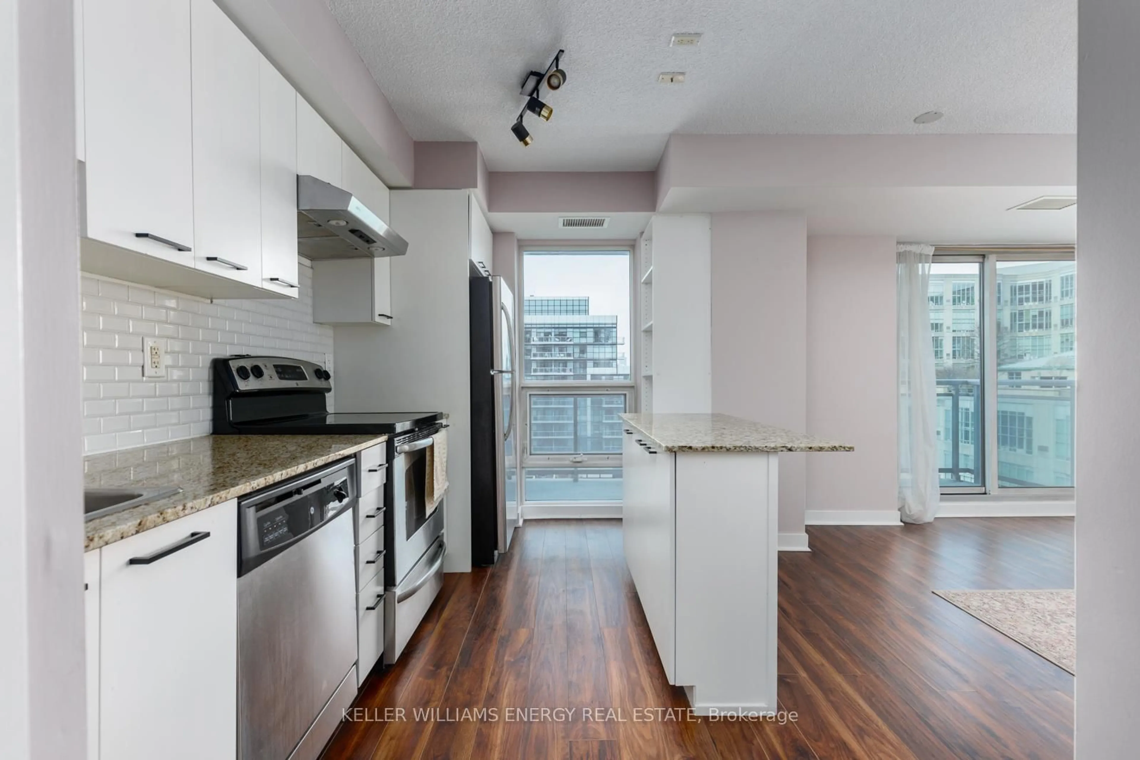 Open concept kitchen, wood/laminate floor for 155 Legion Rd #912, Toronto Ontario M8Y 0A7