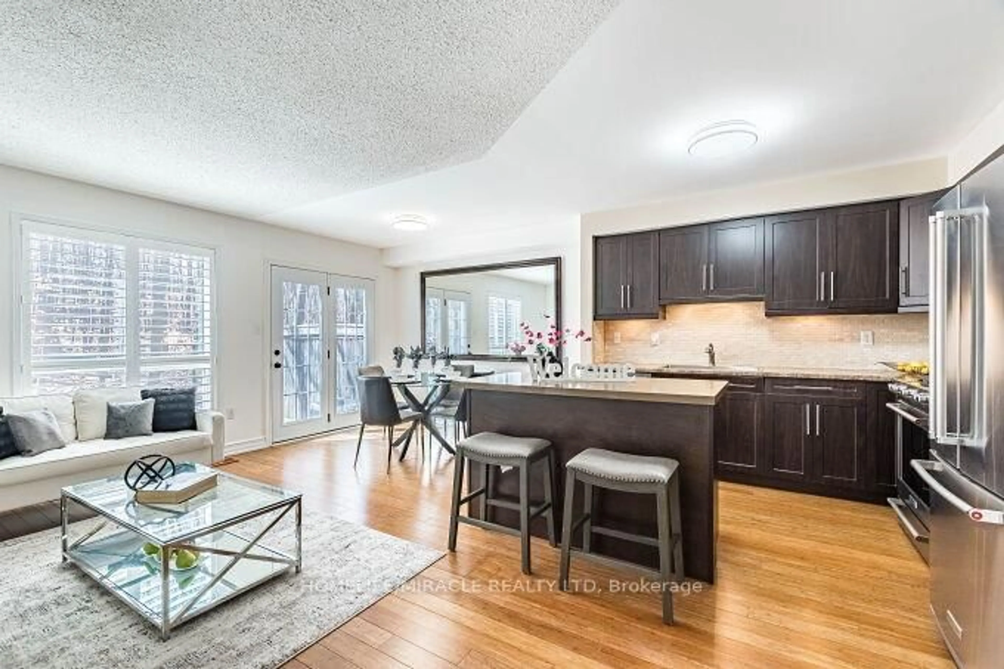 Open concept kitchen, wood/laminate floor for 5530 Glen Erin Dr #28, Mississauga Ontario L5M 6E8