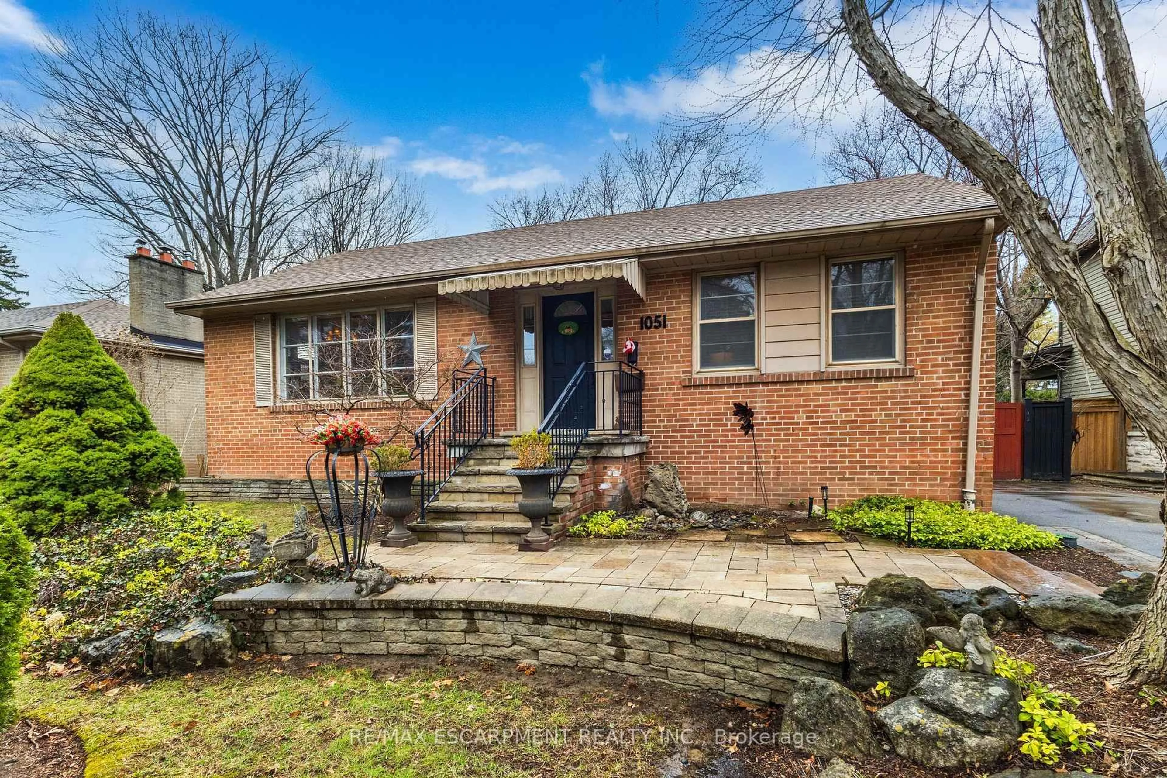 Home with brick exterior material, street for 1051 Melvin Ave, Oakville Ontario L6J 2V8