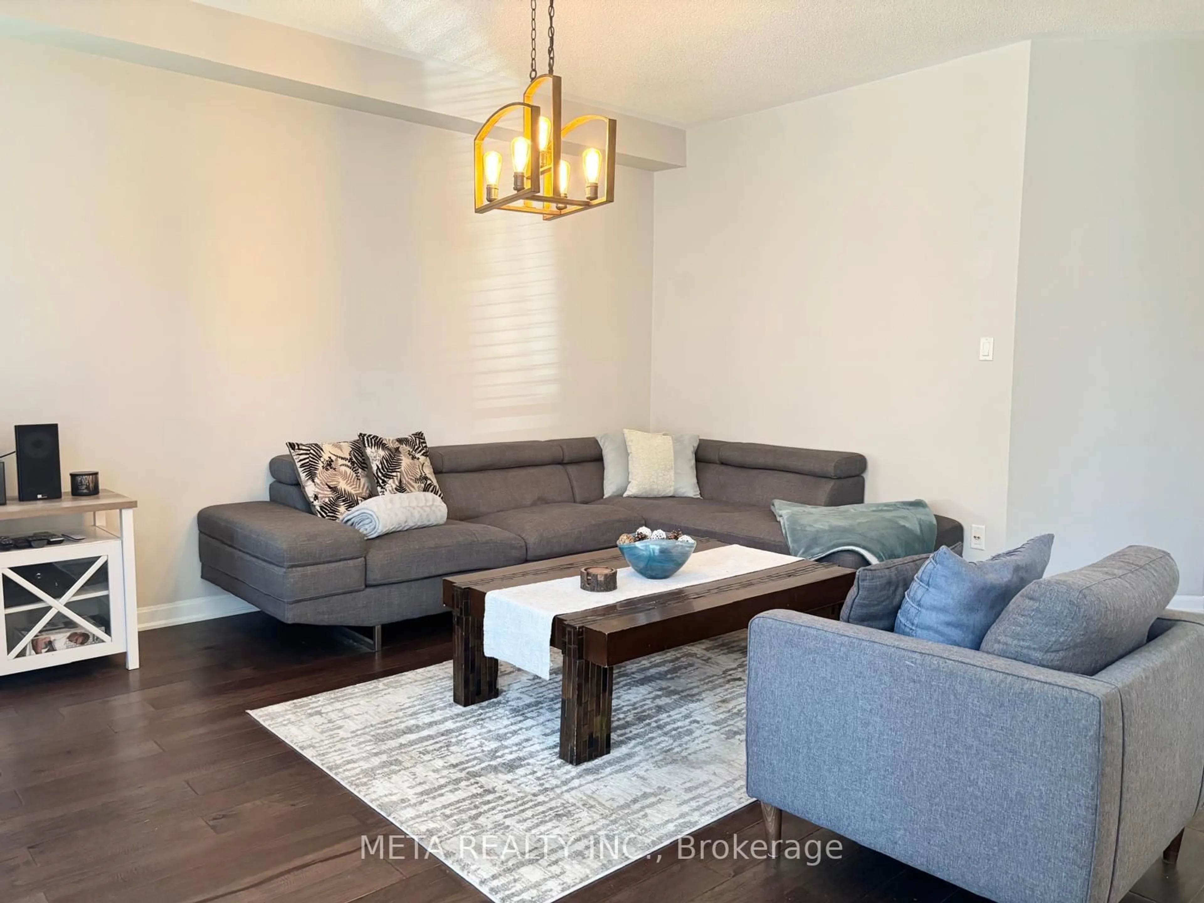 Living room with furniture, wood/laminate floor for 102 Begonia Cres, Brampton Ontario L7A 0M7