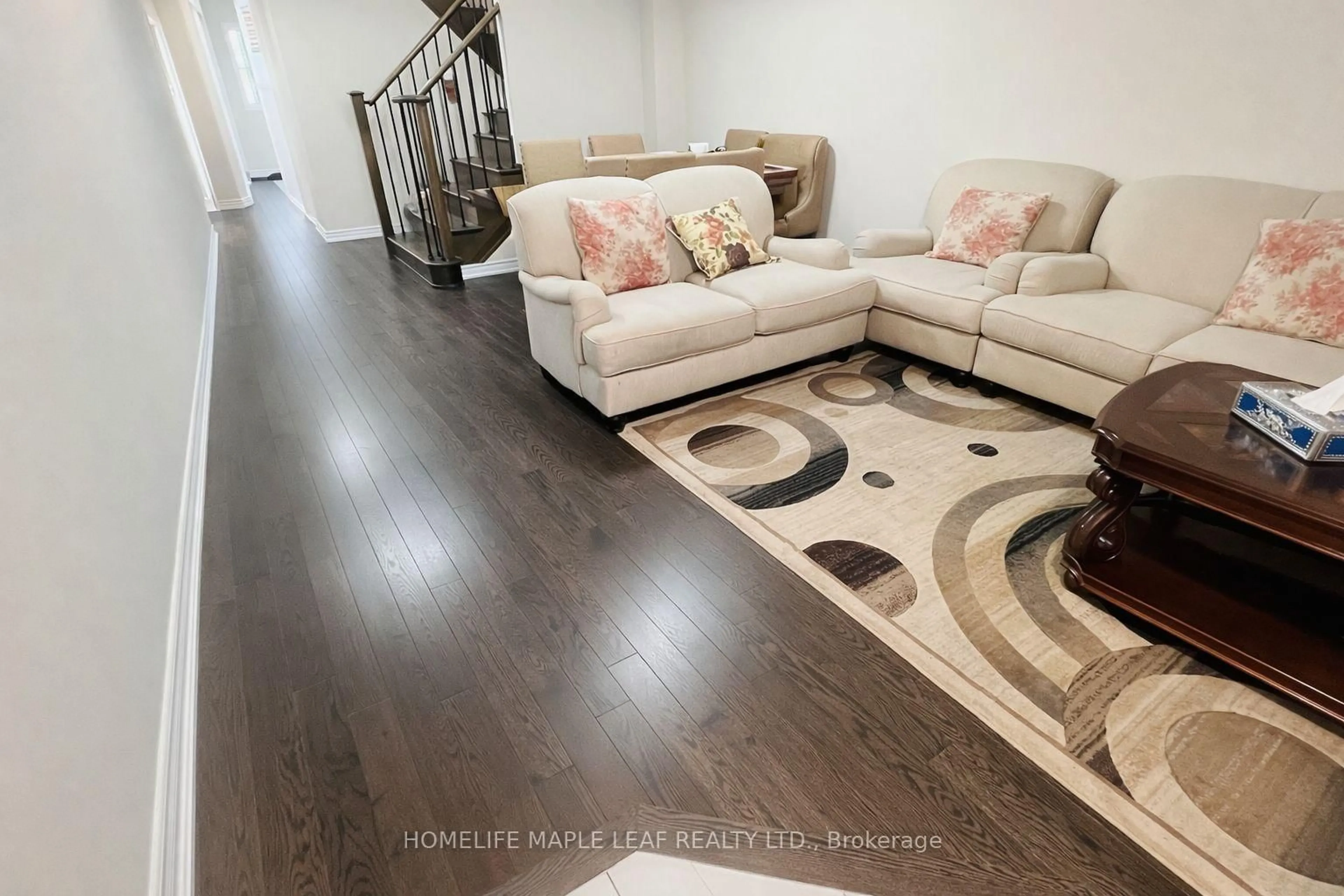 Living room with furniture, wood/laminate floor for 67 Folgate Cres, Brampton Ontario L6R 4A7