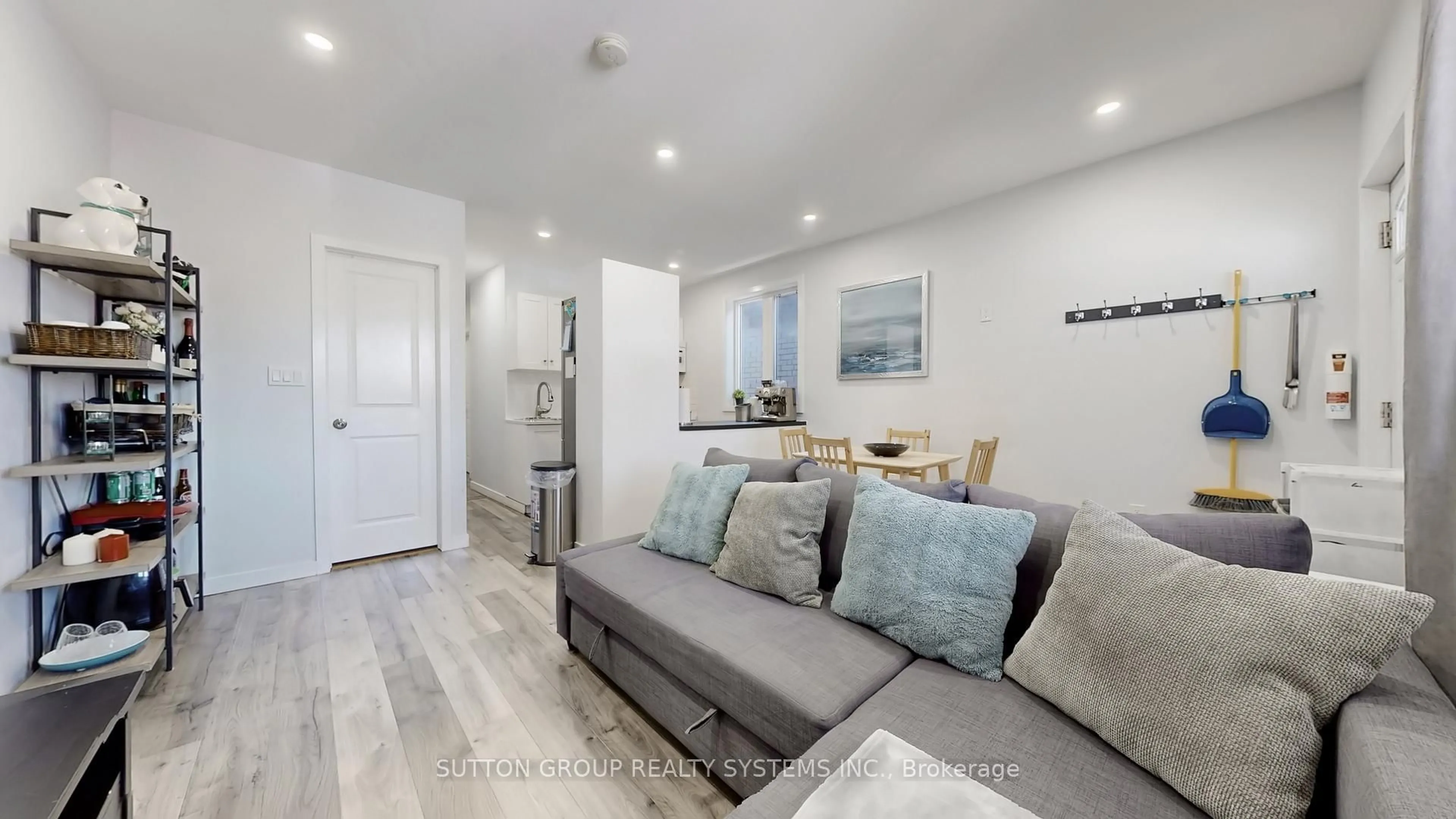 Living room with furniture, wood/laminate floor for 50 Brownville Ave, Toronto Ontario M4N 4L3