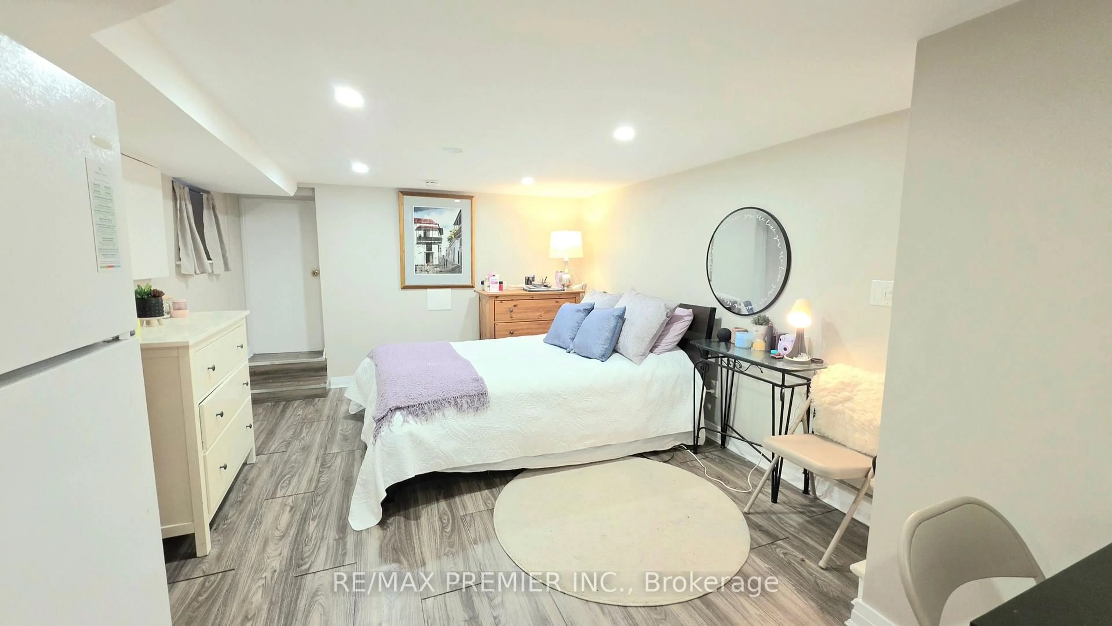 Bedroom with bed, wood/laminate floor for 75 Auburn Ave, Toronto Ontario M6H 2L8