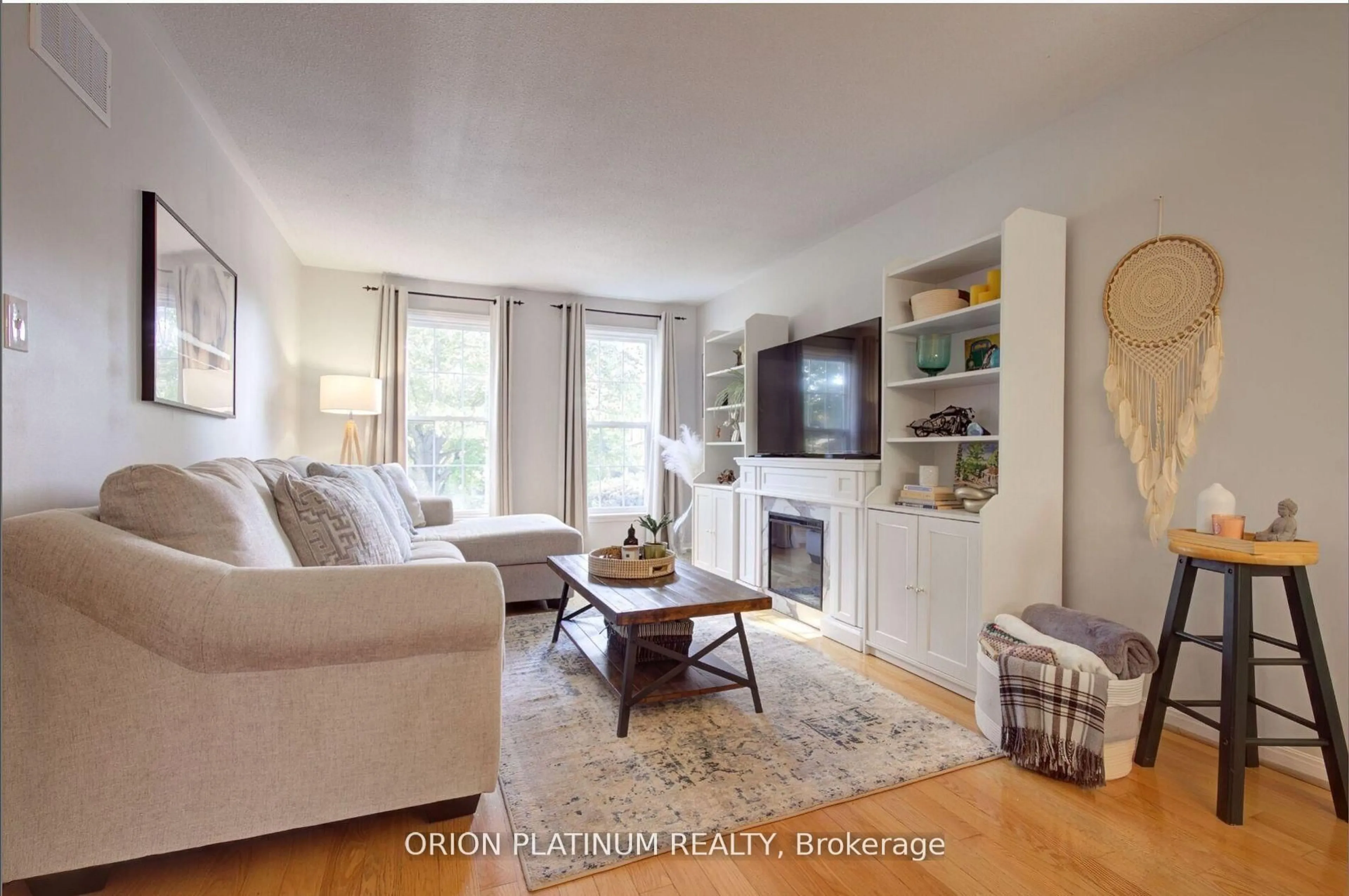 Living room with furniture, wood/laminate floor for 1706 Branchwood Park, Mississauga Ontario L4W 2E6