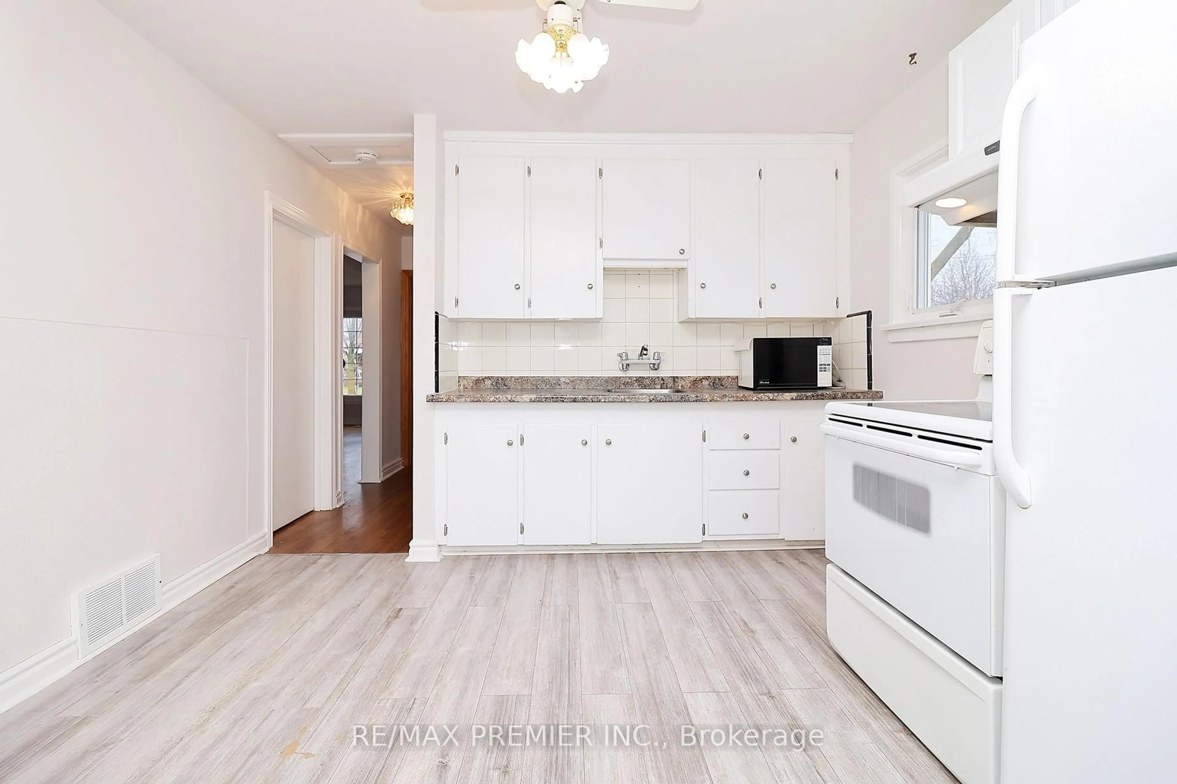 Standard kitchen, wood/laminate floor for 15 Boniface Ave, Toronto Ontario M9W 1T5