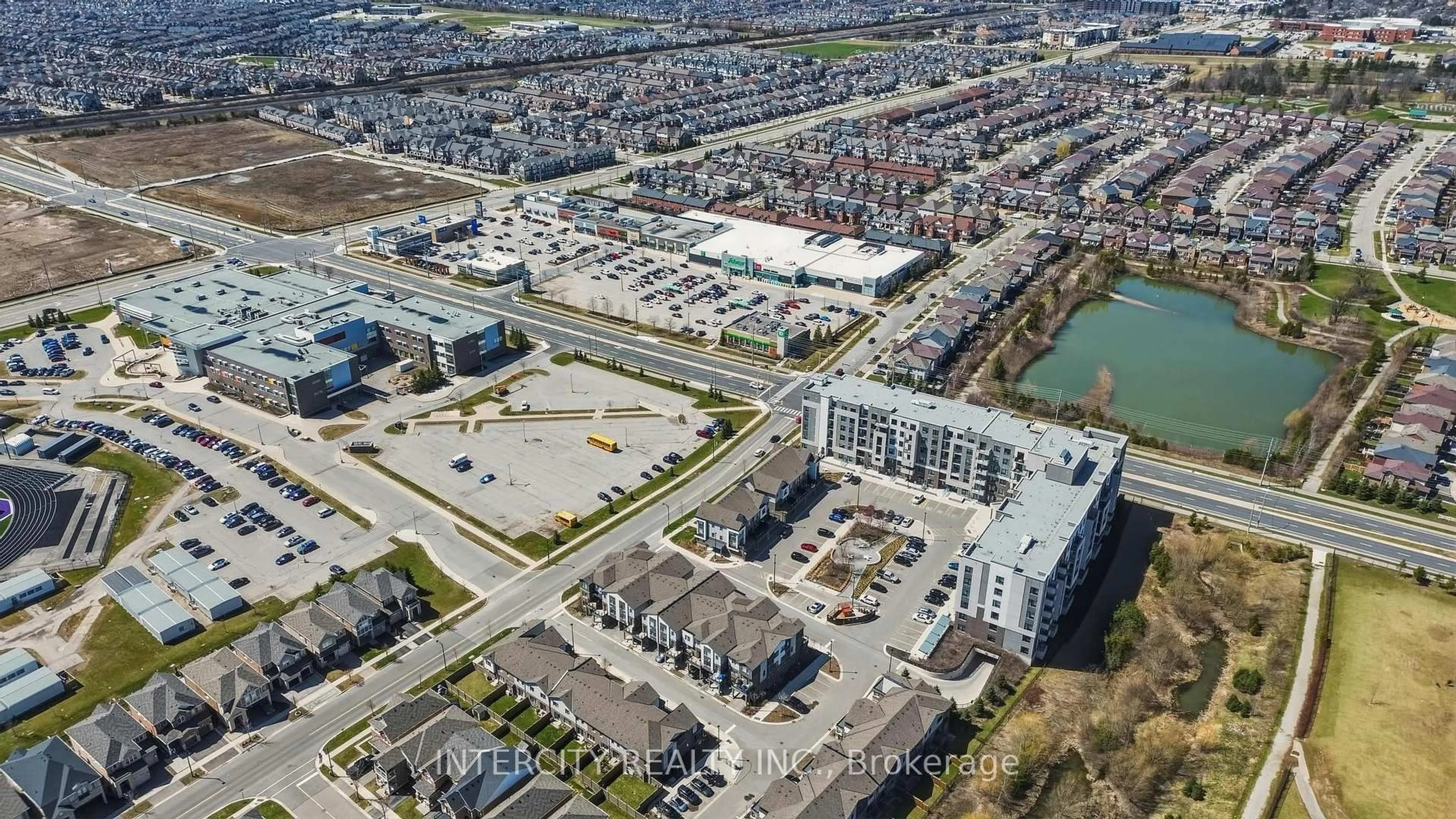 A pic from outside/outdoor area/front of a property/back of a property/a pic from drone, street for 1105 Leger Way #504, Milton Ontario L9E 1K7