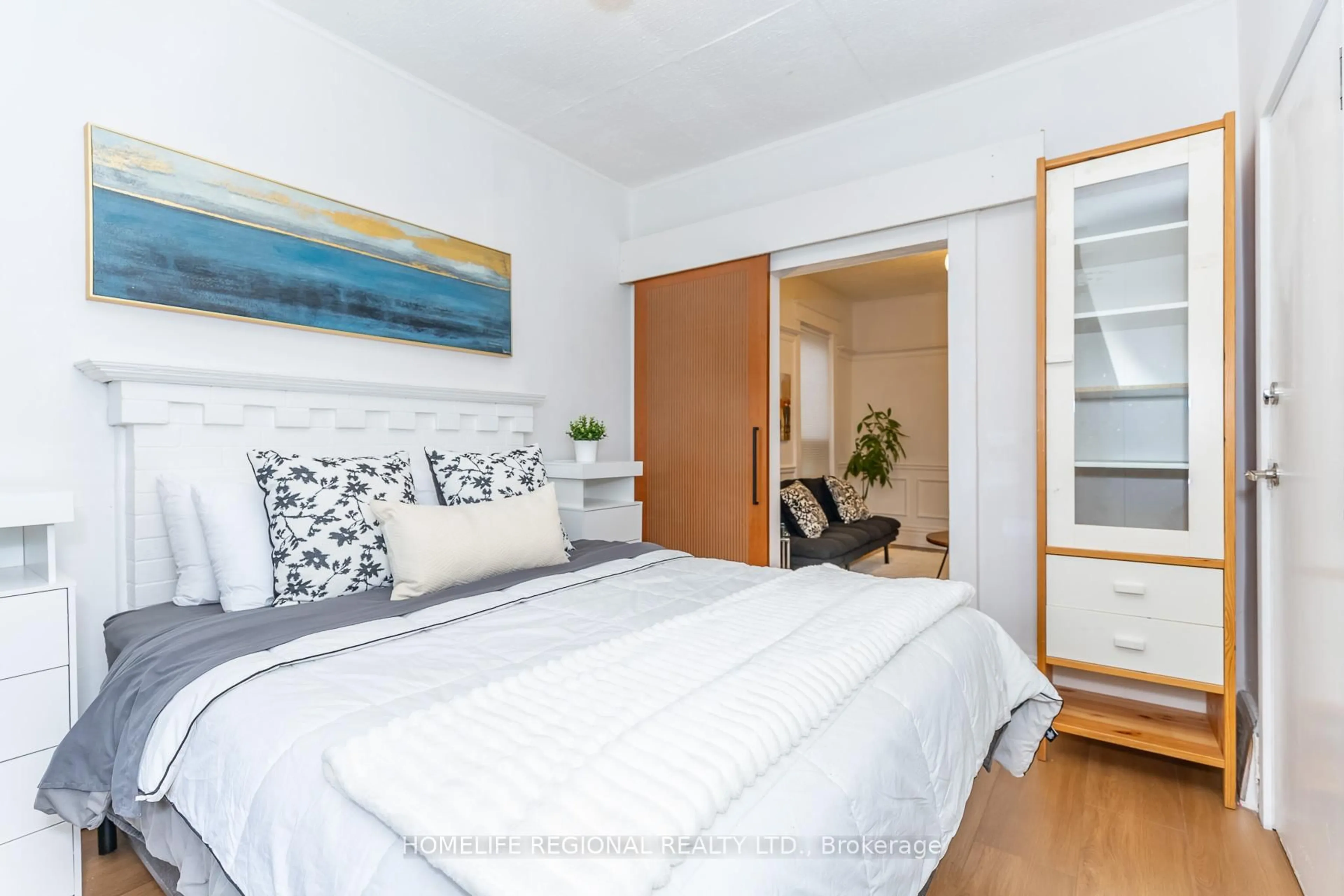 Bedroom with bed, wood/laminate floor for 2378 St Clair Ave, Toronto Ontario M6N 1K8