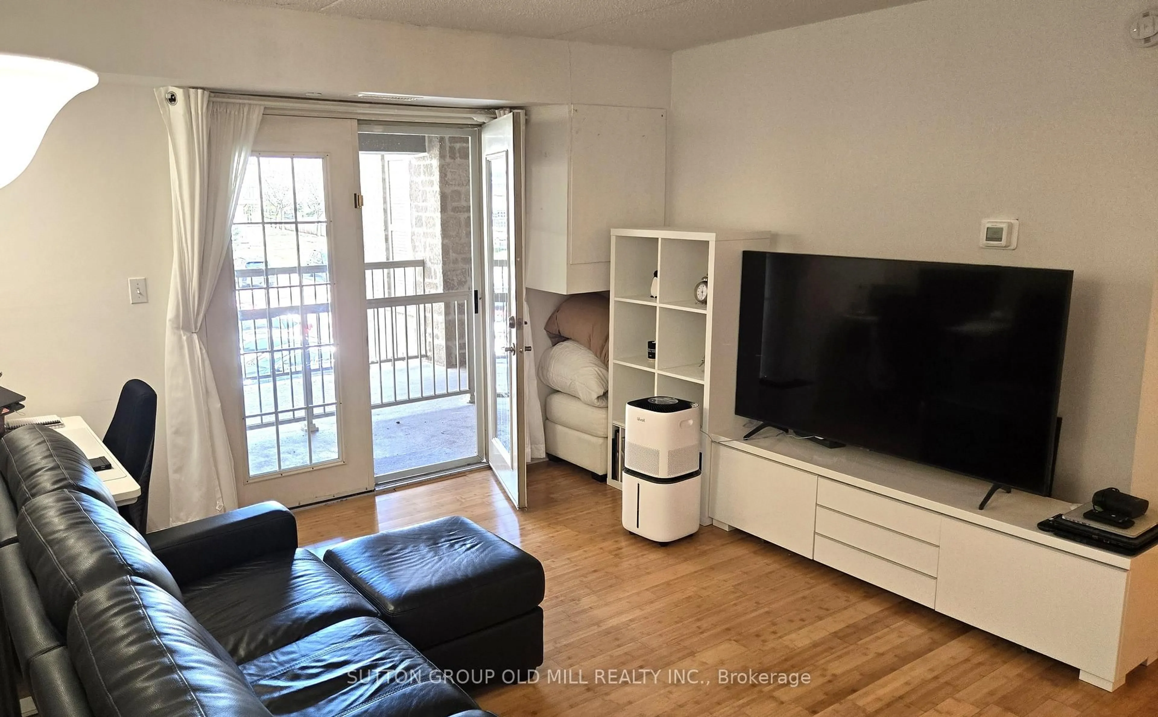 Living room with furniture, wood/laminate floor for 1470 Bishops Gate #208, Oakville Ontario L6M 4N2