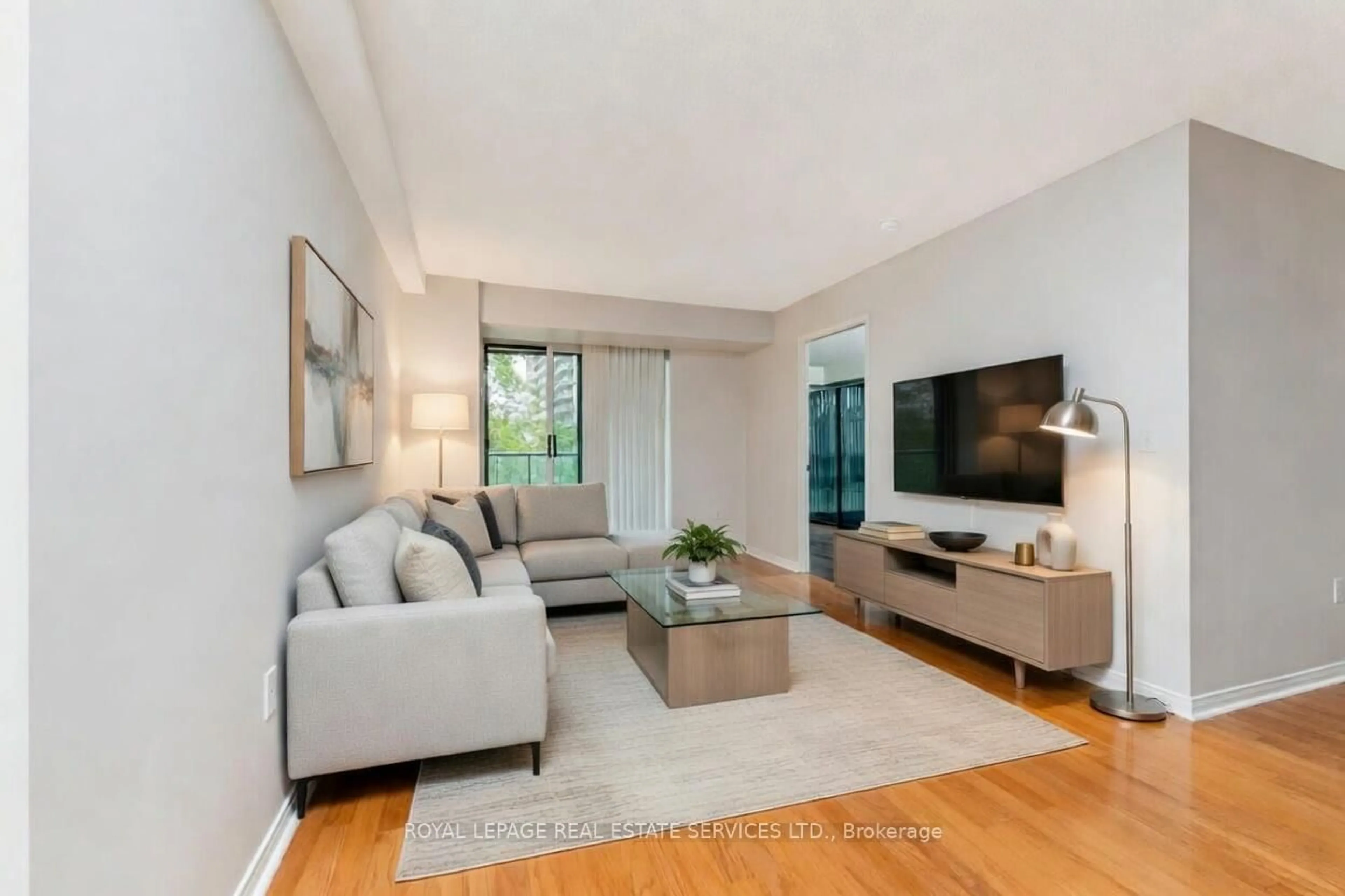 Living room with furniture, unknown for 17 Michael Power Pl #311, Toronto Ontario M9A 5G5