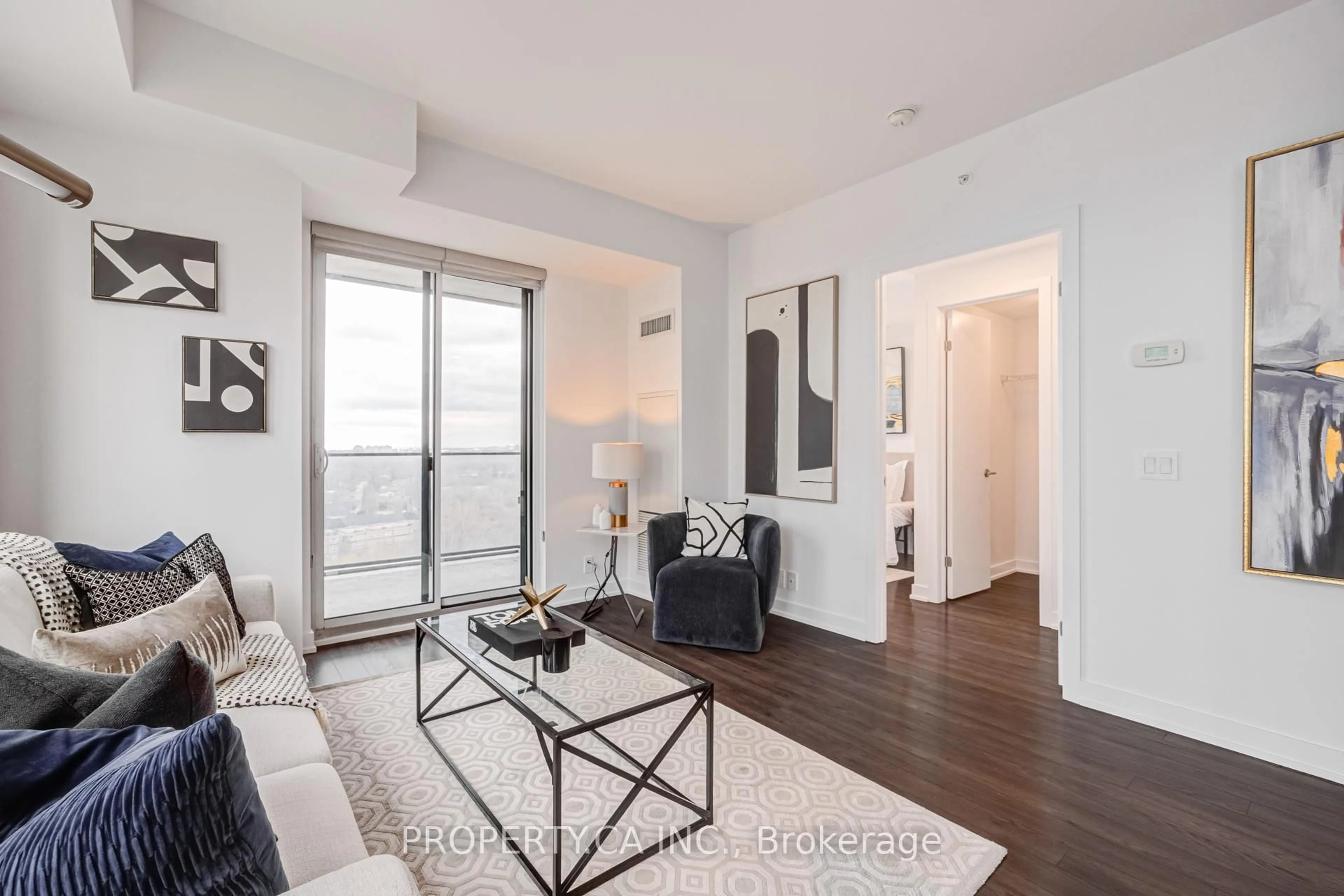 Living room with furniture, wood/laminate floor for 10 Park Lawn Rd #1501, Toronto Ontario M8V 0H9