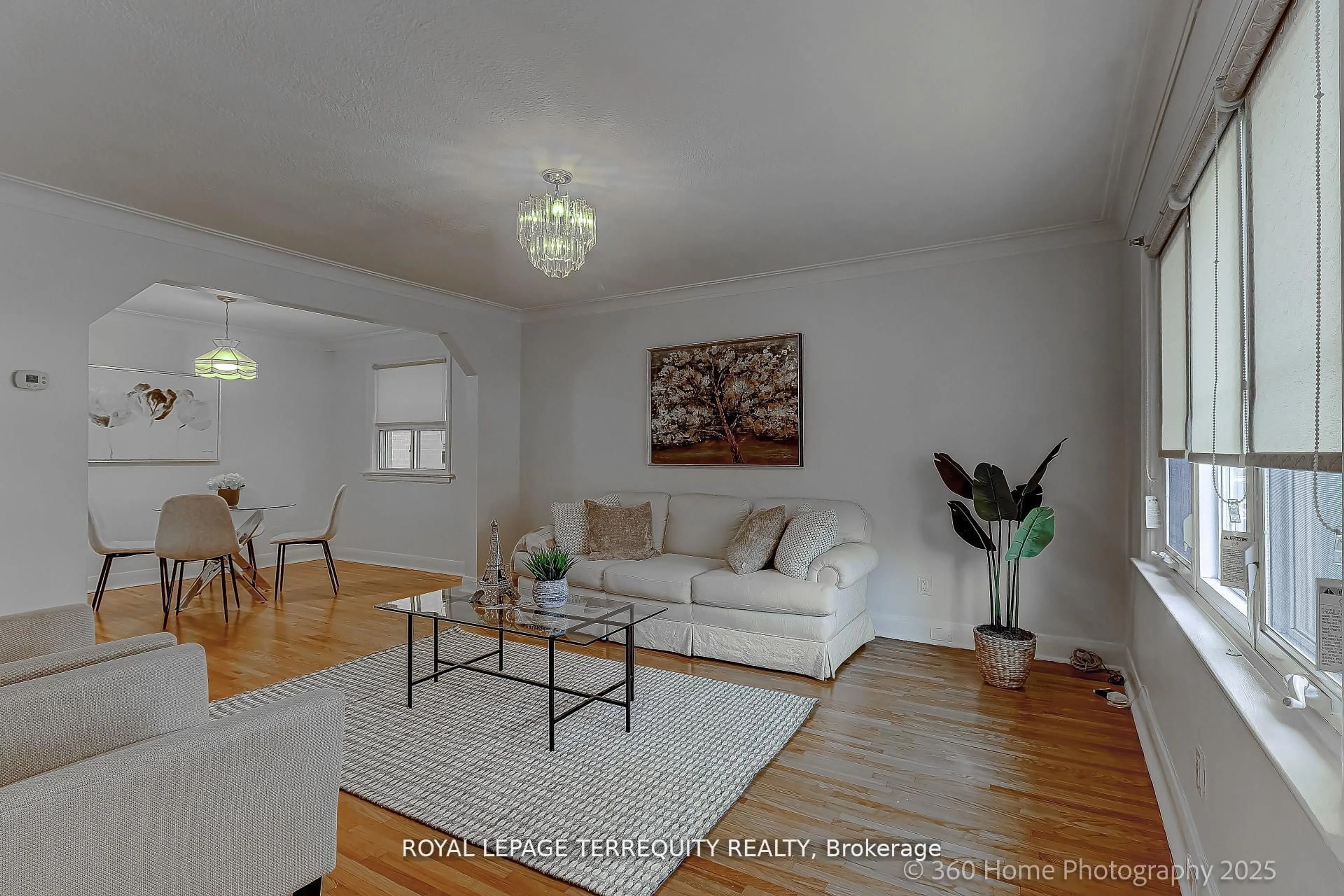 Living room with furniture, wood/laminate floor for 27 John Best Ave, Toronto Ontario M9N 1C4