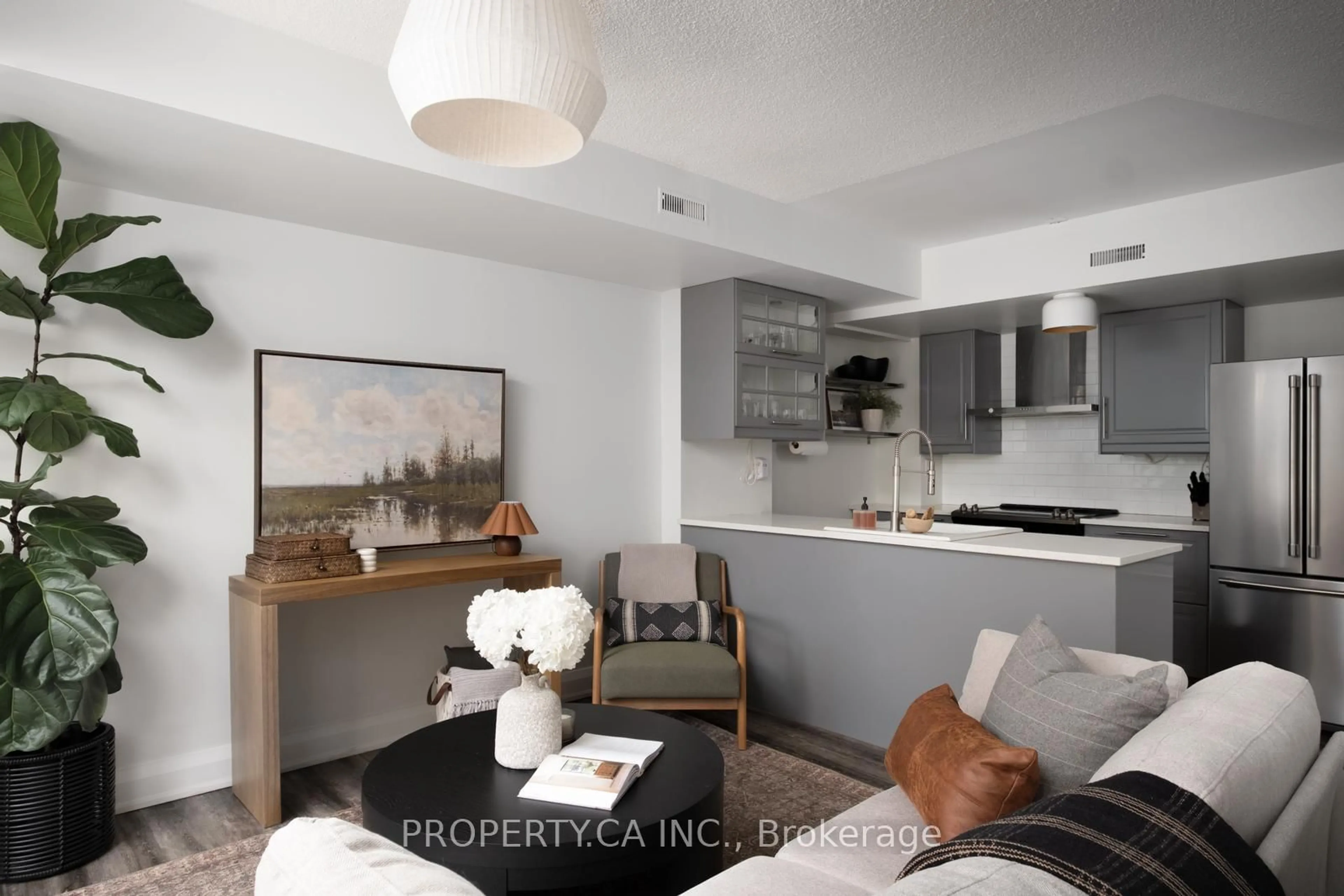 Living room with furniture, unknown for 25 Turntable Cres #133, Toronto Ontario M6H 4K8