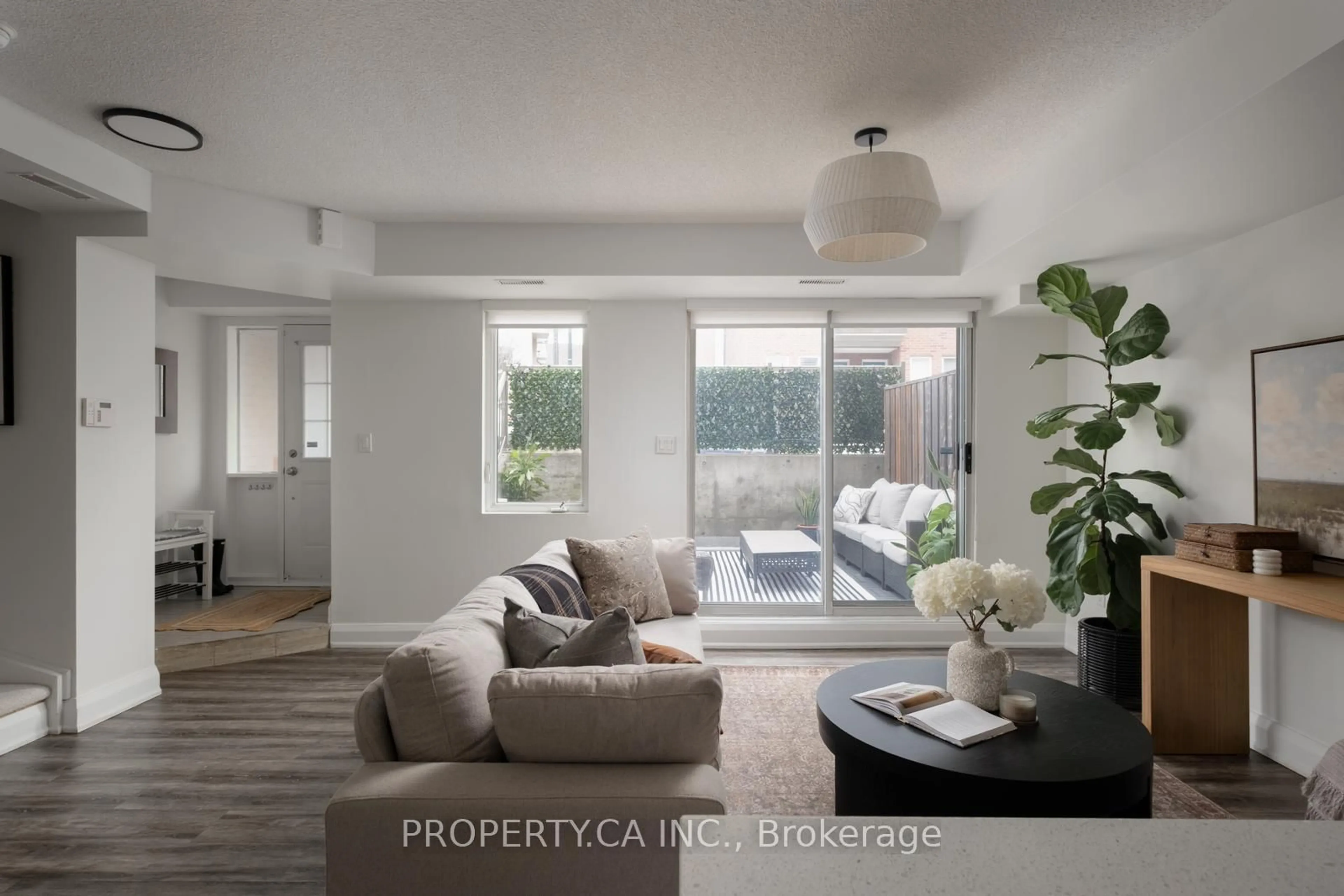 Living room with furniture, unknown for 25 Turntable Cres #133, Toronto Ontario M6H 4K8