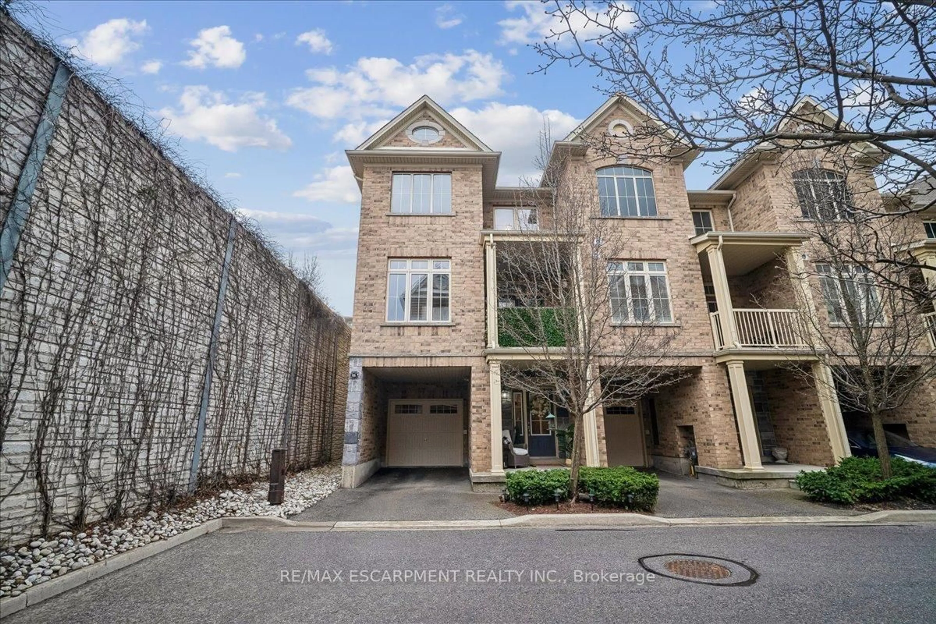 Home with brick exterior material, street for 181 Plains Rd ##40, Burlington Ontario L7T 0B1