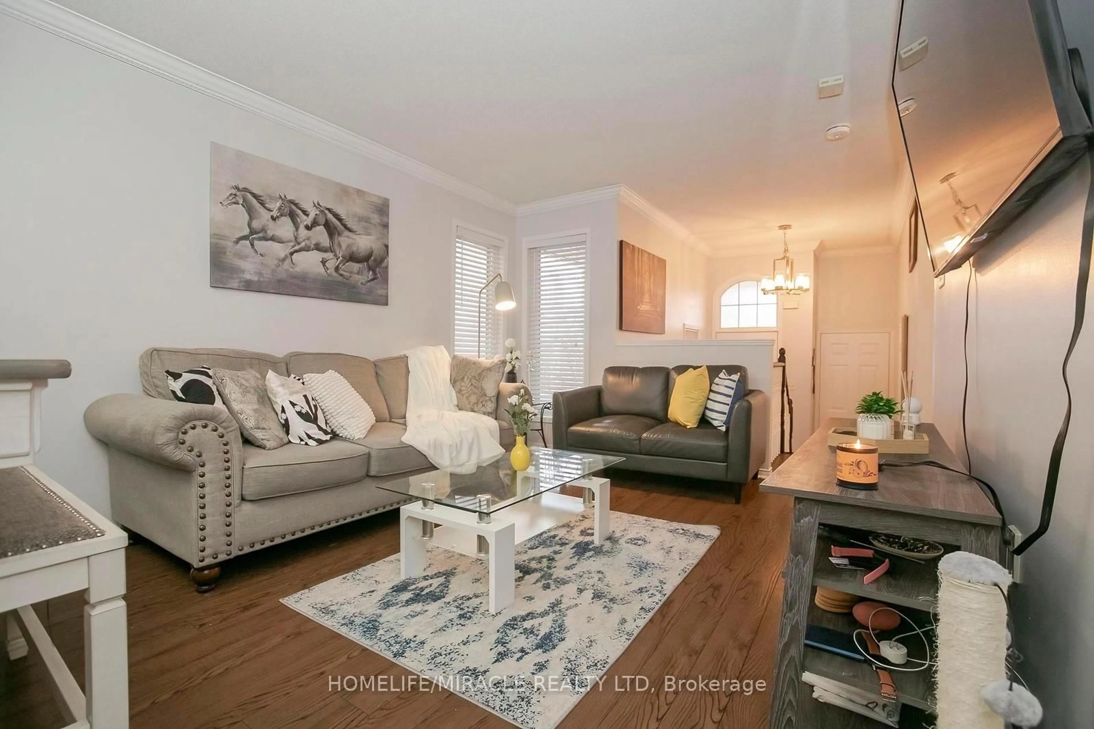 Living room with furniture, wood/laminate floor for 45 Vintage Gate, Brampton Ontario L6X 5C3