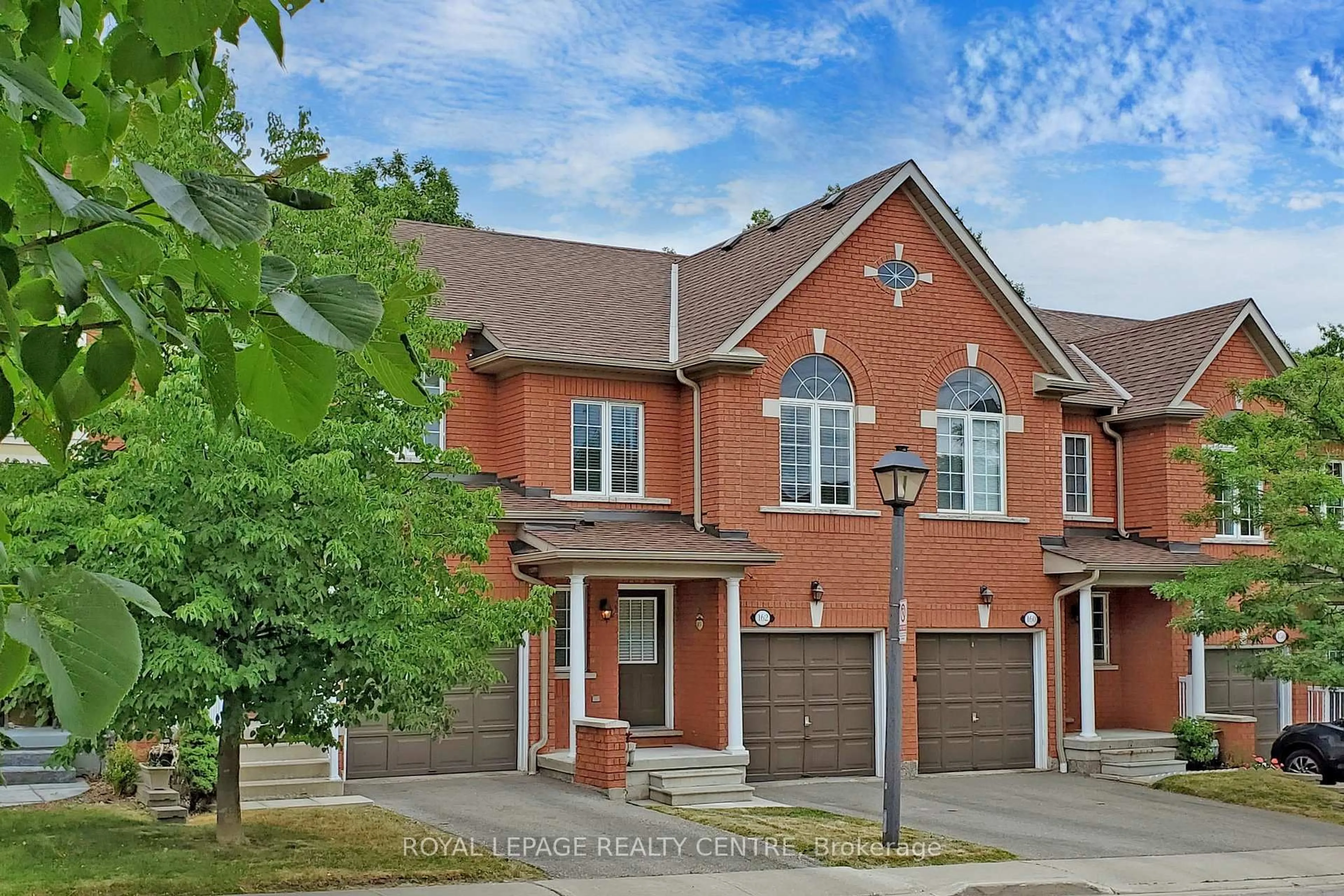Home with brick exterior material, street for 7360 Zinnia Pl #162, Mississauga Ontario L5W 2A1