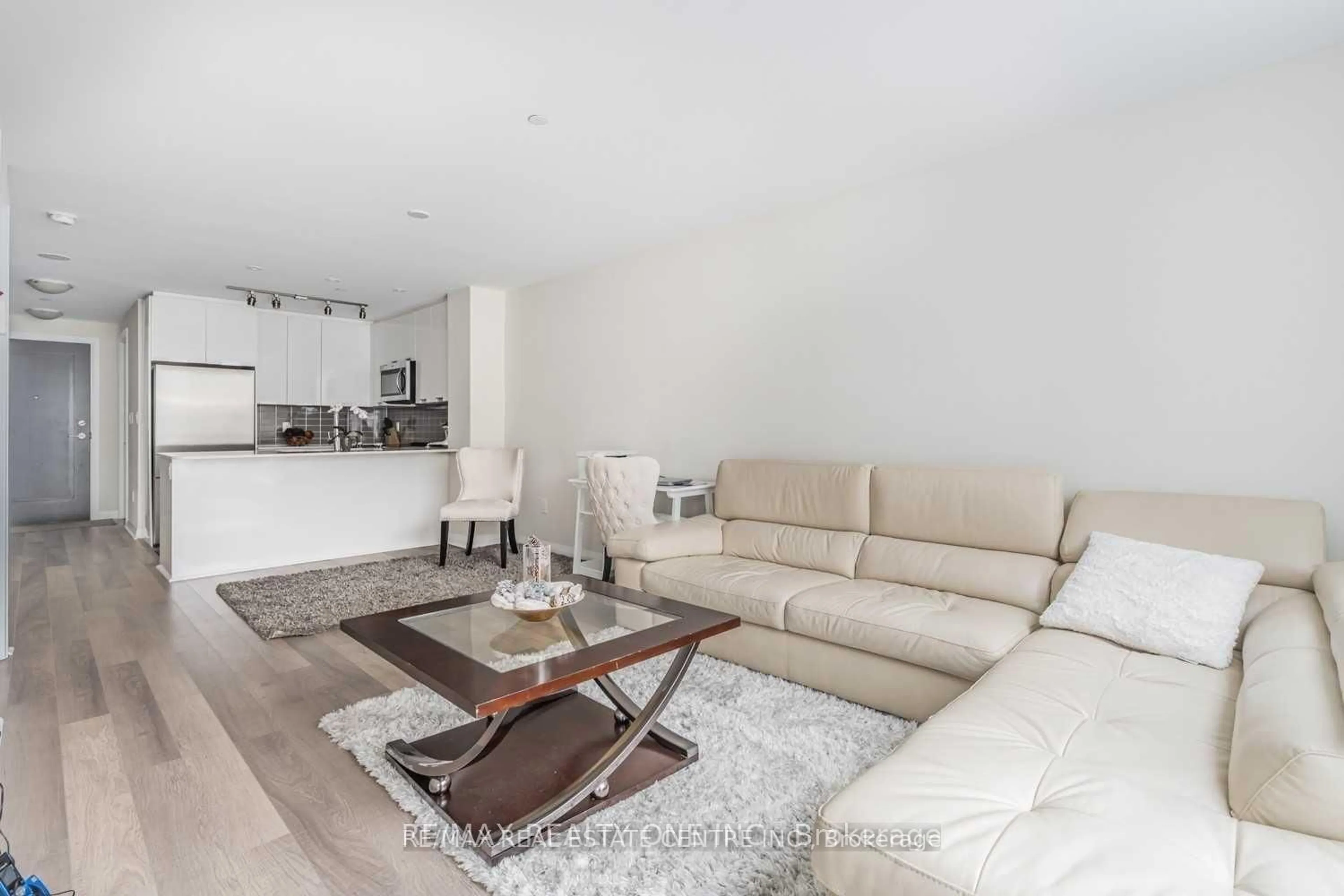 Living room with furniture, unknown for 5025 Four Springs Ave #112, Mississauga Ontario L5R 0G5