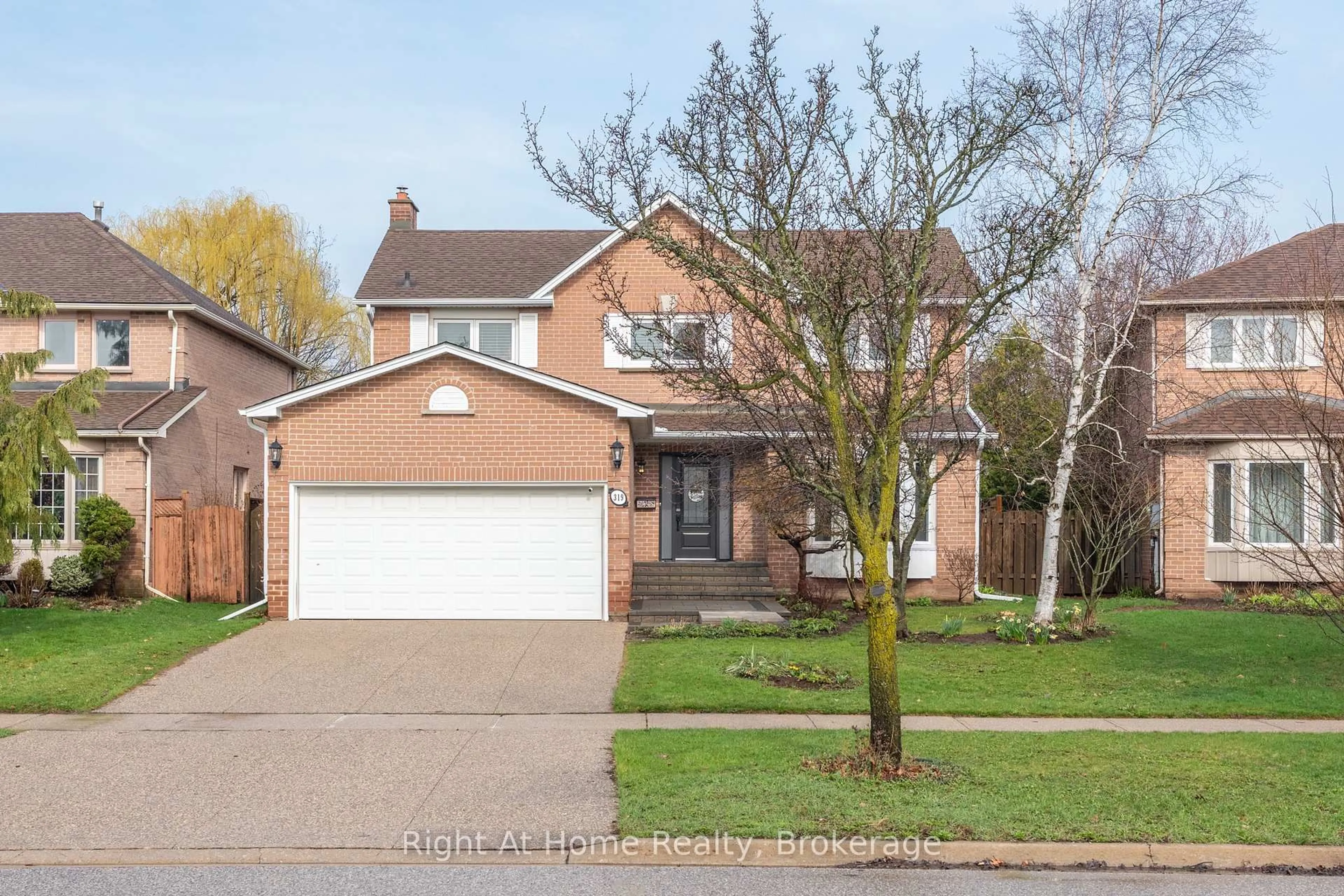 Home with brick exterior material, street for 319 River Oaks Blvd, Oakville Ontario L6H 3X5