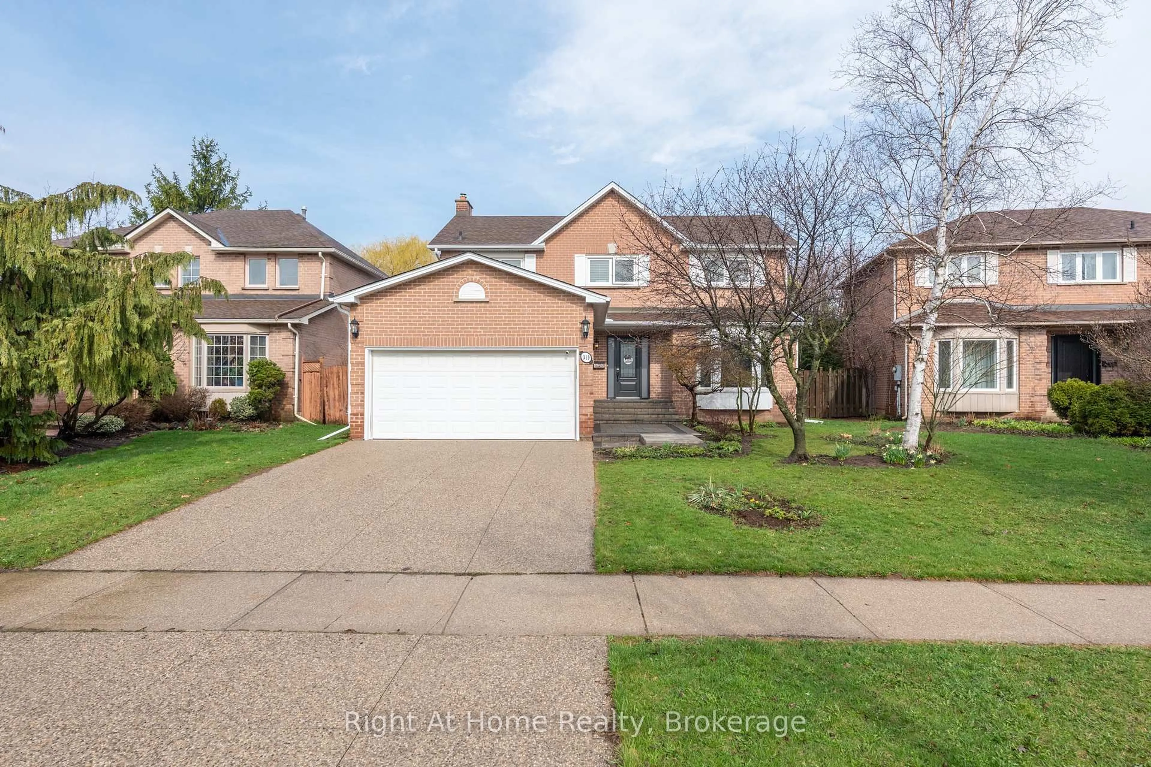Home with brick exterior material, street for 319 River Oaks Blvd, Oakville Ontario L6H 3X5
