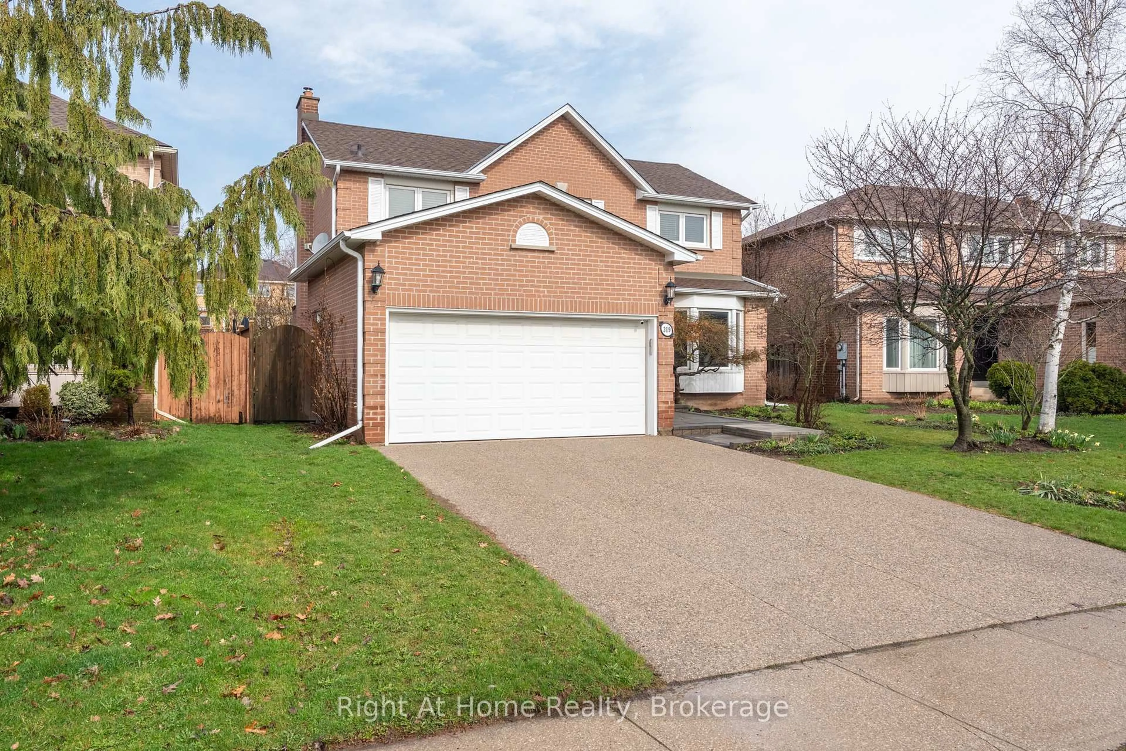 Home with brick exterior material, street for 319 River Oaks Blvd, Oakville Ontario L6H 3X5