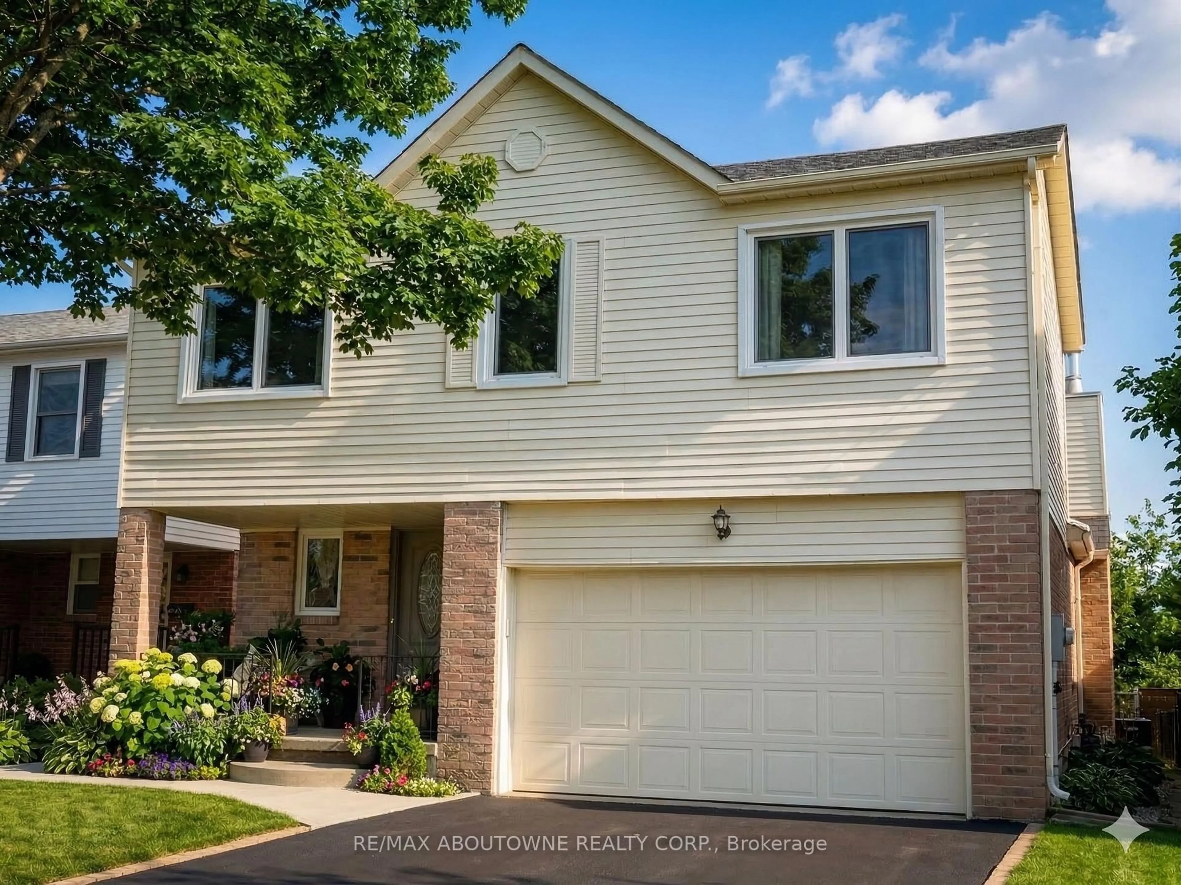 Home with brick exterior material, street for 1148 Bridlewood Tr, Oakville Ontario L6M 2L2