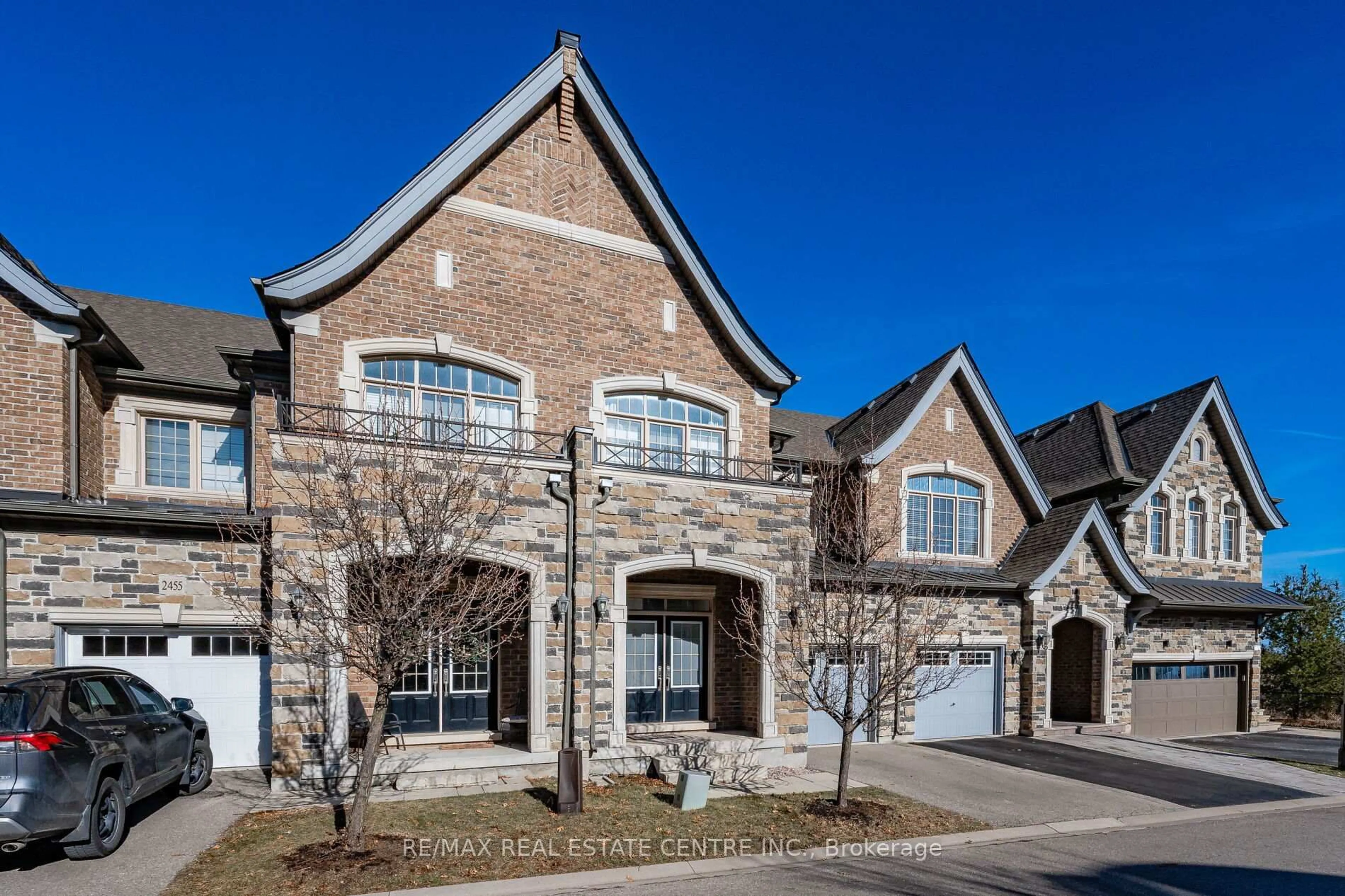 Home with brick exterior material, street for 2453 Village Common, Oakville Ontario L6M 0S2
