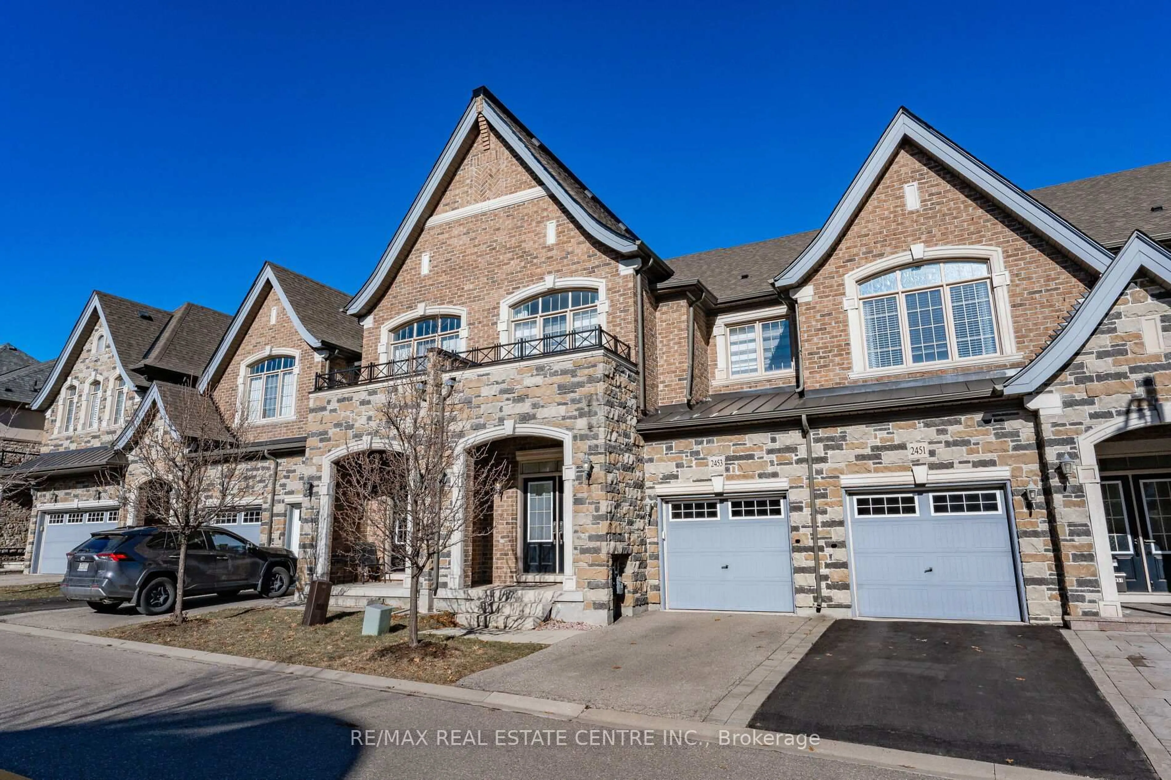 Home with brick exterior material, street for 2453 Village Common, Oakville Ontario L6M 0S2