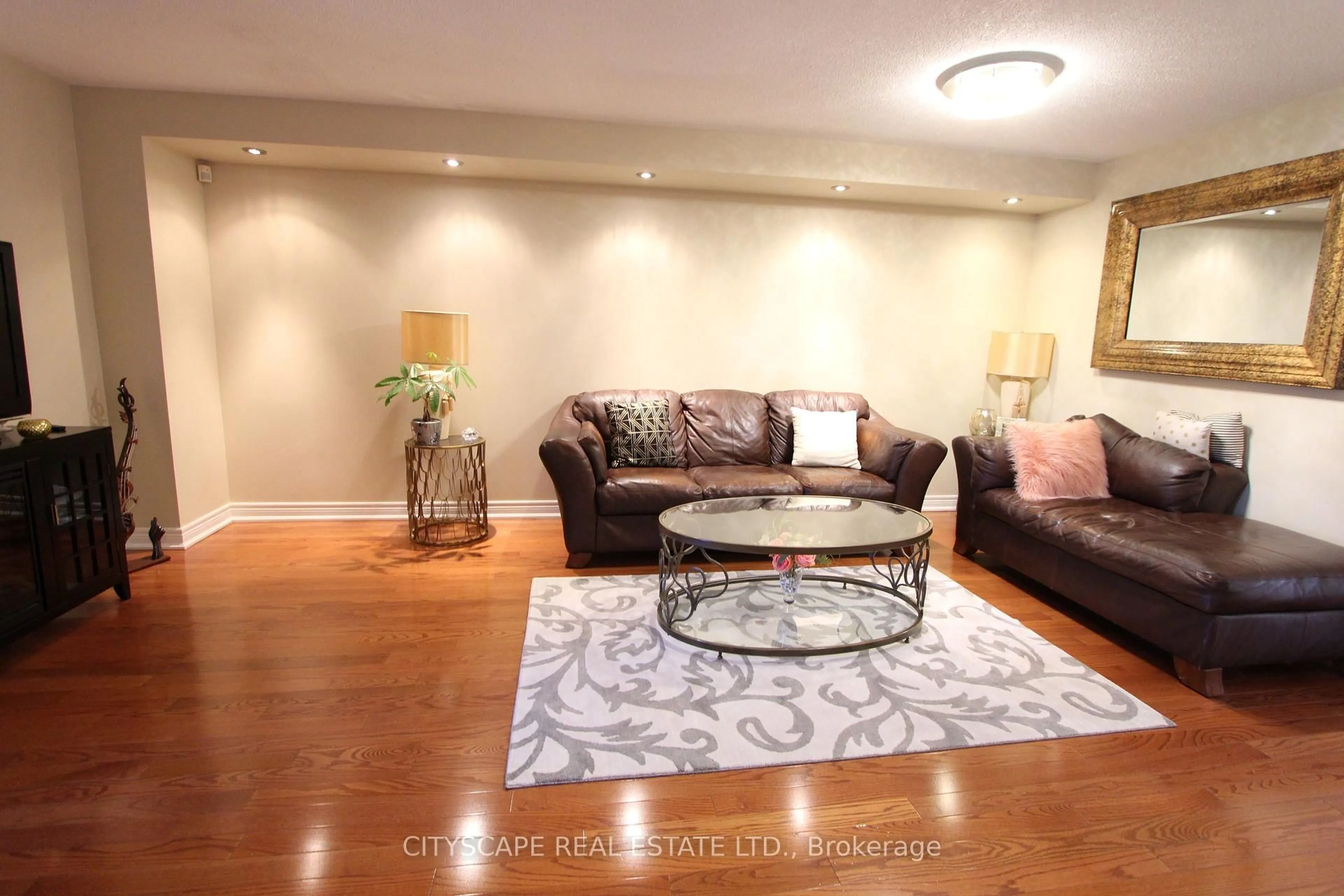 Living room with furniture, wood/laminate floor for 3162 Pearwood Pl, Mississauga Ontario L5B 4H1
