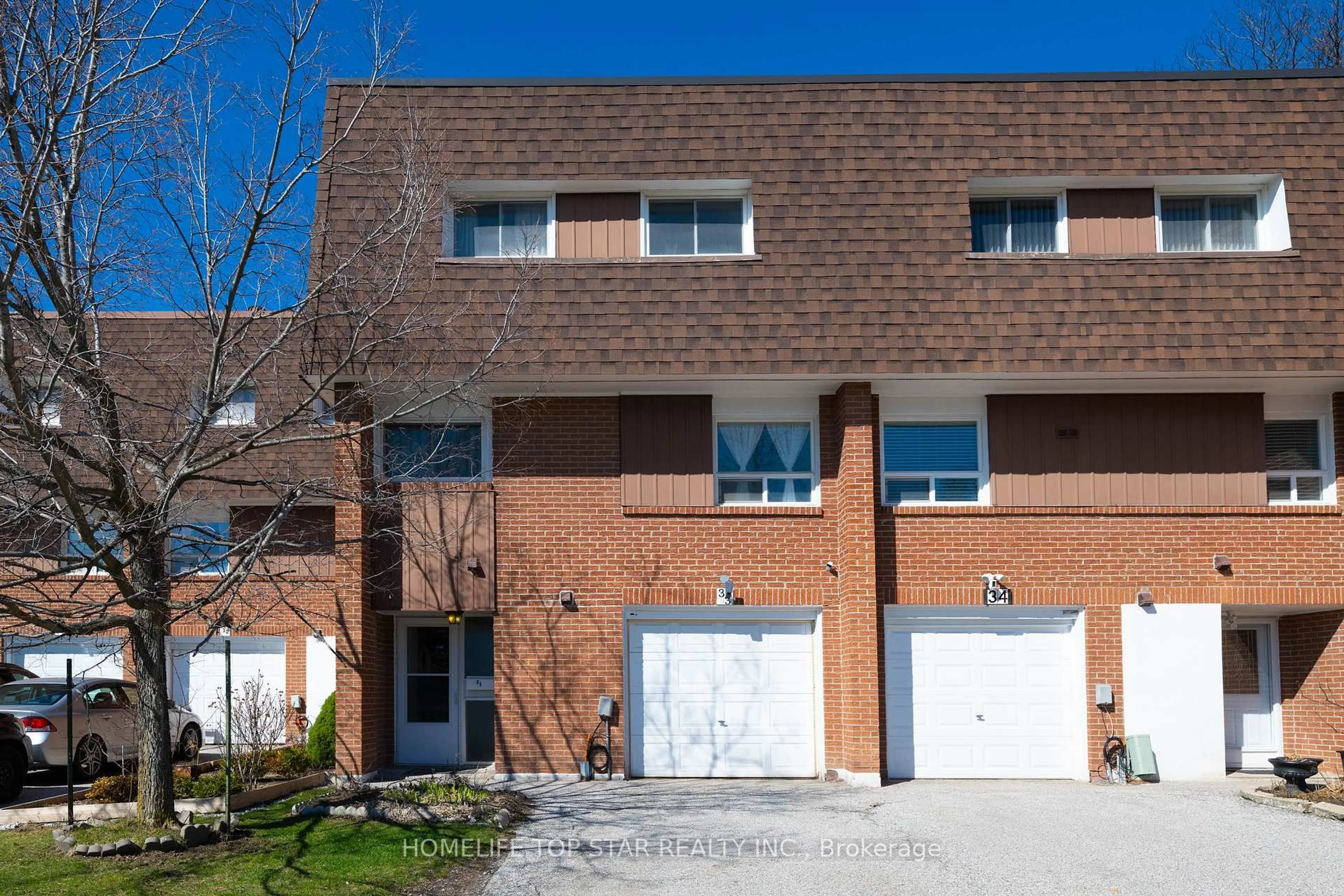 Home with brick exterior material, street for 452 Silverstone Dr #33, Toronto Ontario M9V 3K8